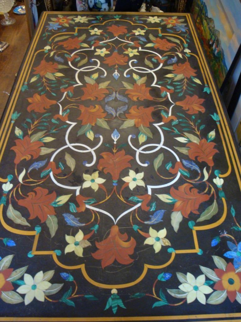 The Following Item we are Offering is A Rare Important Magnificent Black Marble Inlaid Semi Precious Stone Table Inlaid from every region of the World. Stones forming Swags of Floral and Leaf Detail Medallions in the Middle of the Table. Along the