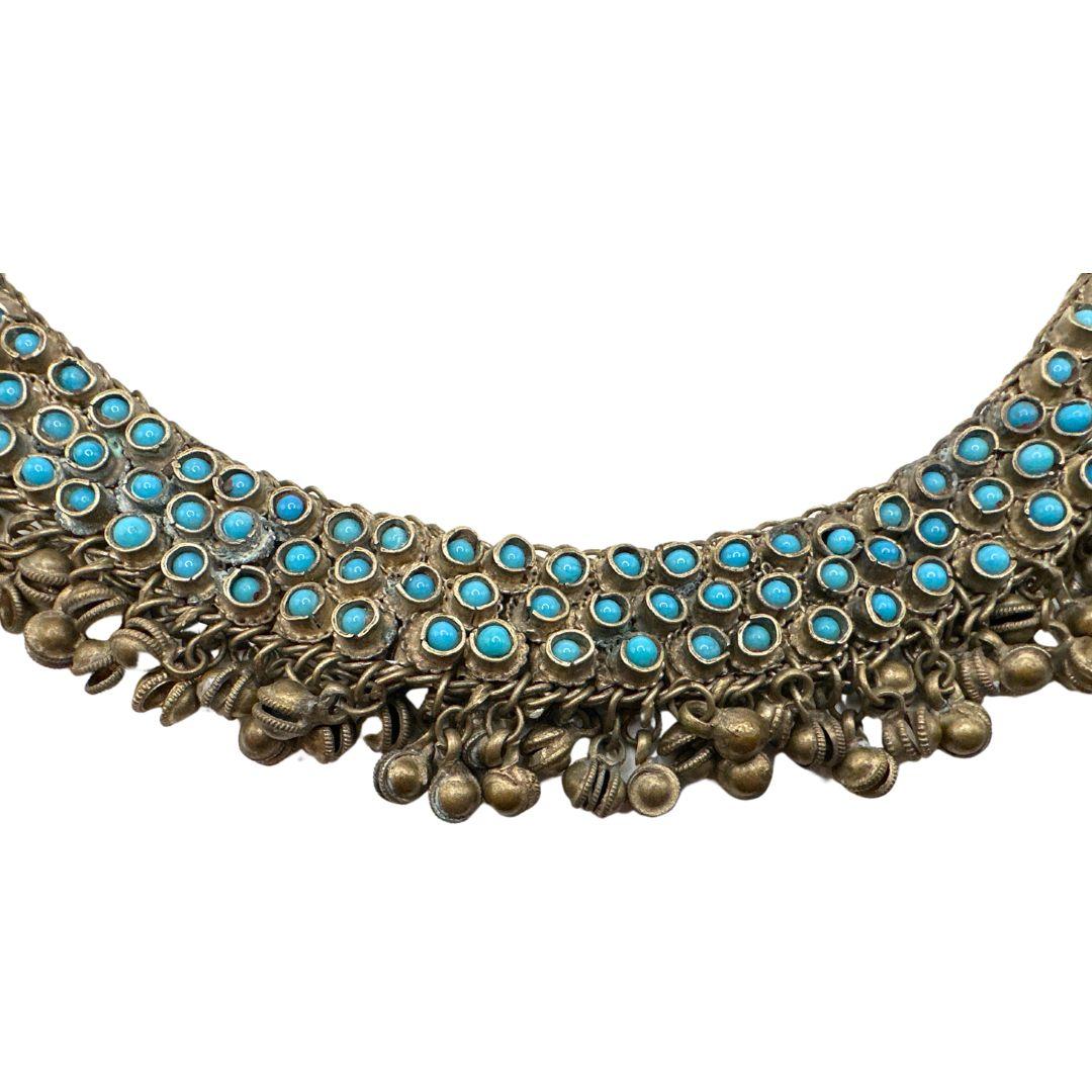 Length: 18.75″

Bin Code: A1 / P7

Discover the captivating beauty of this Indian Antique Silver Turquoise Necklace, a true vintage treasure dating back to the year 1958. This exquisite piece of jewelry combines the rich heritage of India with the