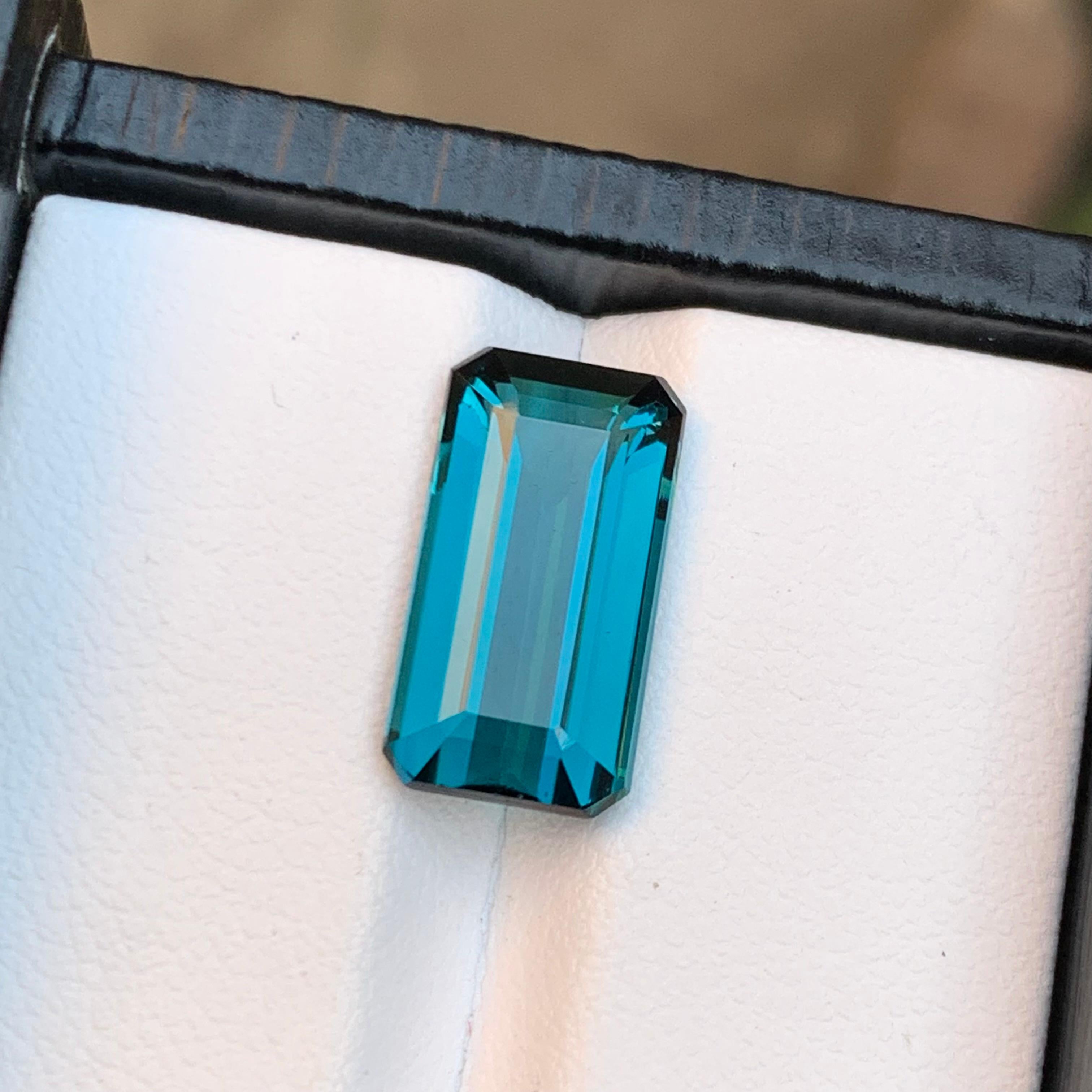 Gemstone Type: Tourmaline
Weight: 5.20 Carats
Dimensions: 14.41 x 7.82 x 5.09 mm
Color: Indicolite Blue
Clarity: Eye Clean
Treatment: Untreated 
Origin: Afghanistan 🇦🇫 
Certificate: On demand 

This stunning emerald-cut indicolite blue tourmaline