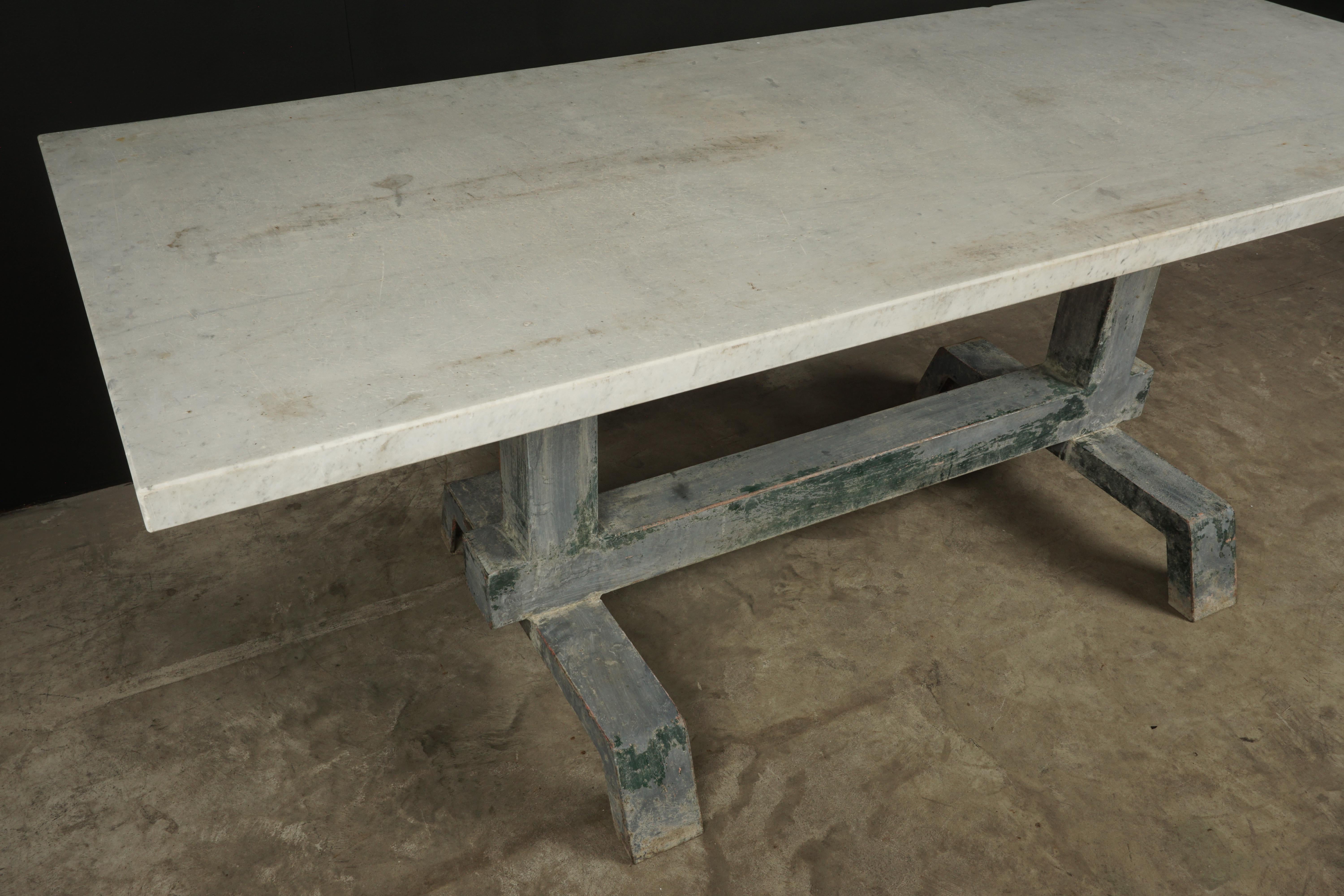 Industrial marble dining table from France, 1940s. Solid, thick marble top.  Steel base with fantastic original patina.