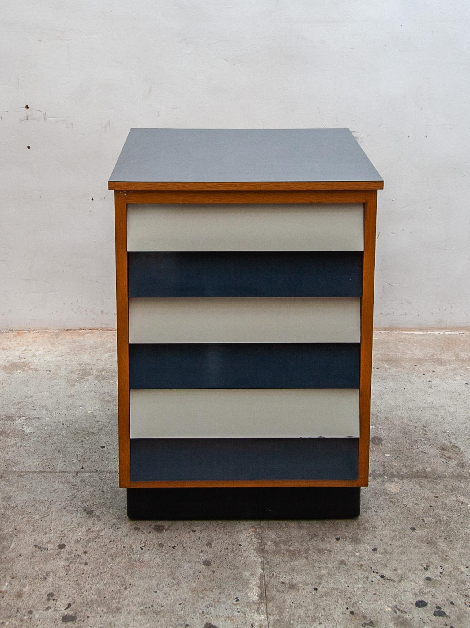 Rare industrial two tone cabinet attributed to Willy van der Meeren for Tubax, Belgium 1958. This Modernist cabinet has blue and white laminated drawers and a gray laminated top the sideboard construction is in solid beech. This typical fifties