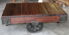 Rare Industrial Type Iron and Teak Wood Coffee Table with Iron Wheels