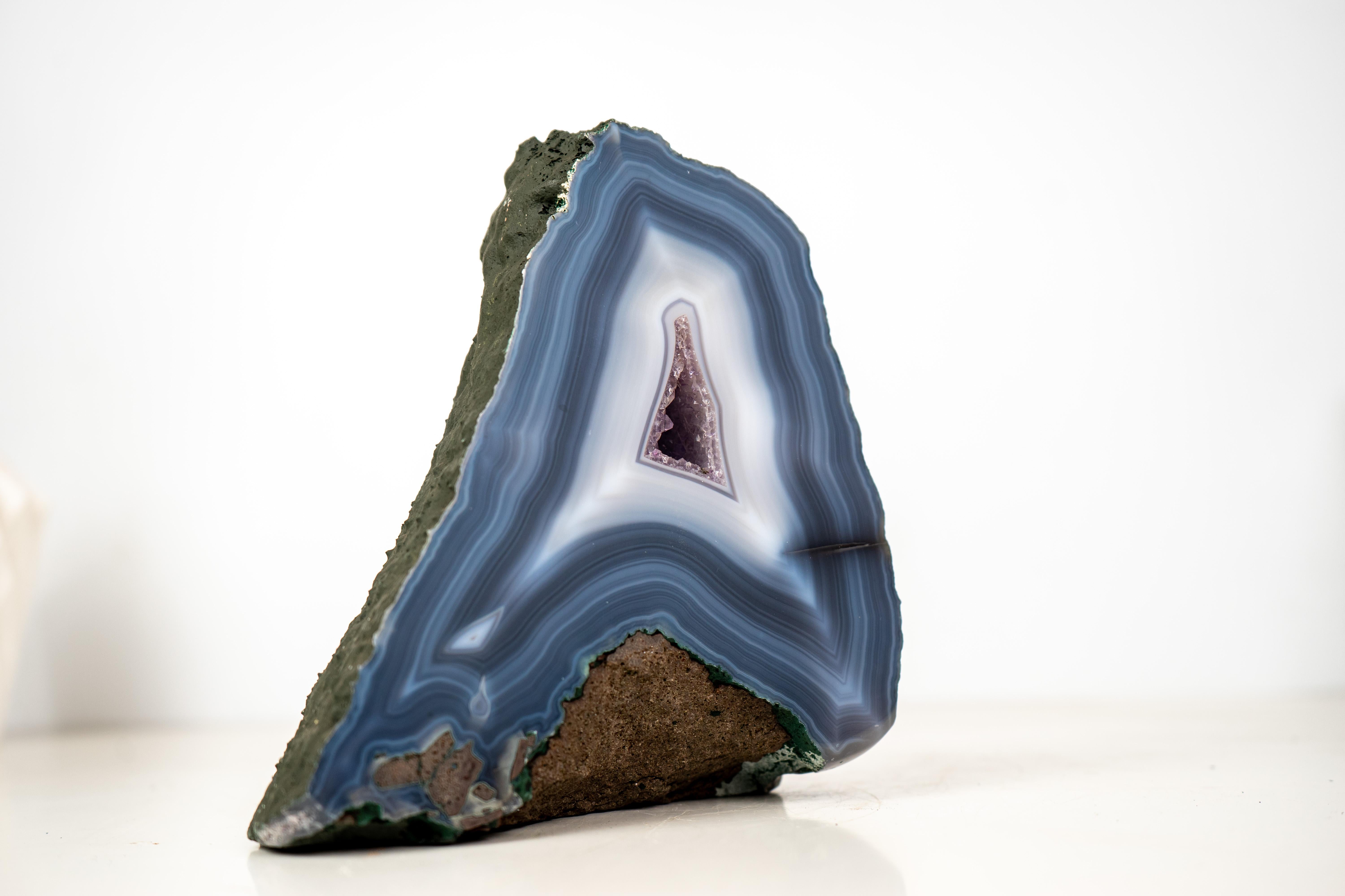 All-Natural Agate Artwork: Rare Blue and White Lace Agate Geode with Amethyst Core, Intact

▫️Description

A rare specimen with exceptional aesthetics, this agate geode brings together unique, seldom-seen characteristics in a perfectly intact