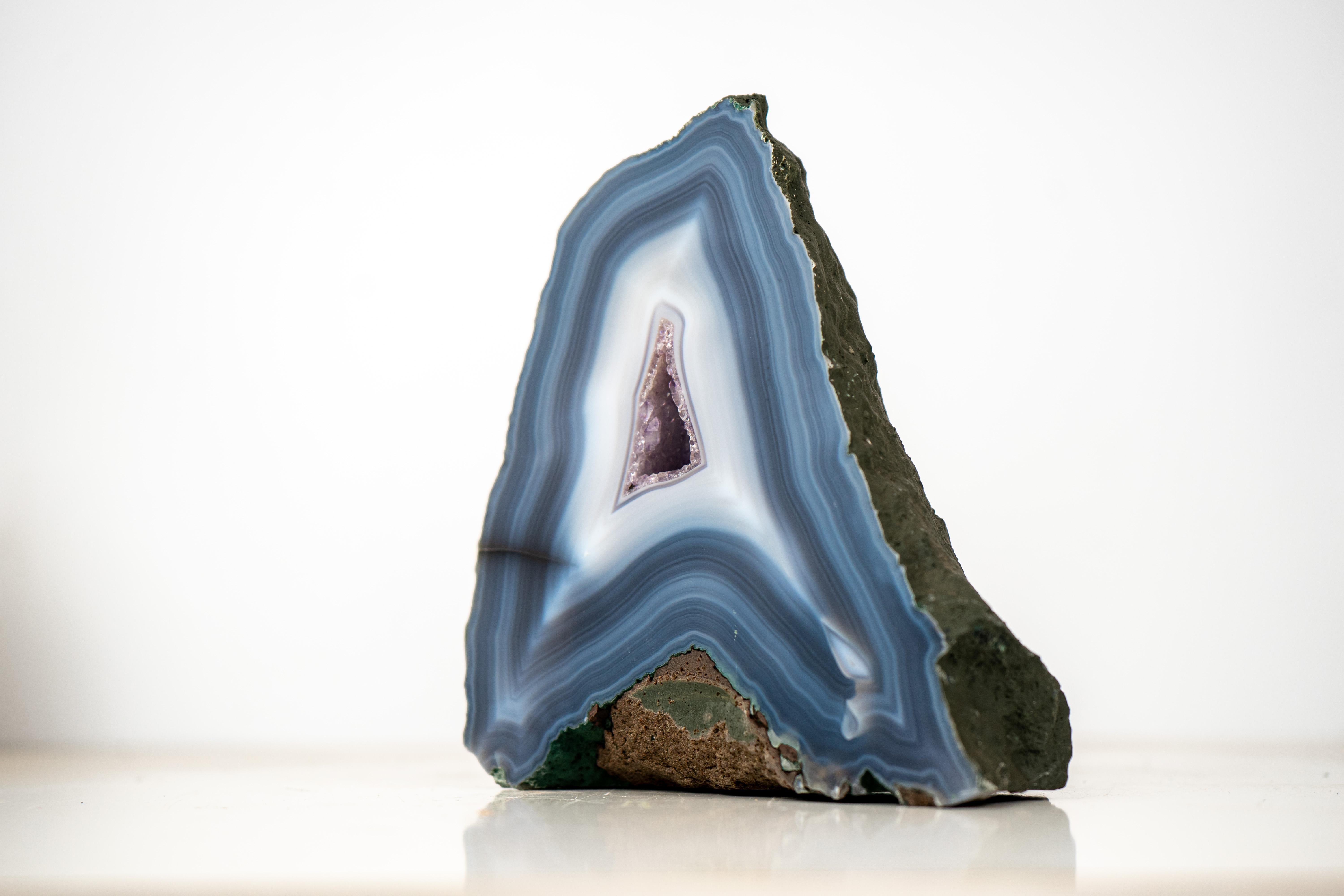 All-Natural Agate Artwork: Rare Blue and White Lace Agate Geode with Amethyst Core, Intact

▫️Description

A rare specimen with exceptional aesthetics, this agate geode brings together unique, seldom-seen characteristics in a perfectly intact