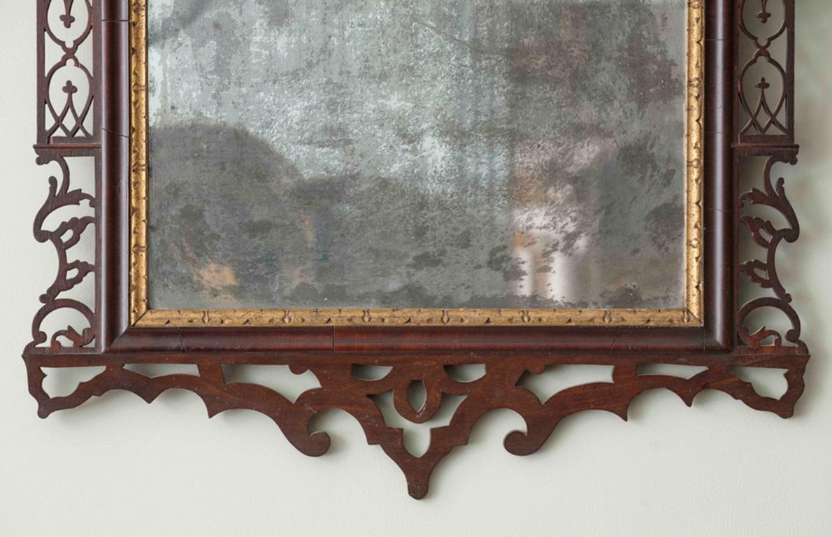 A Rare mid 18th Century Irish Carved Mahogany Pier Mirror with parcel gilt eagle cresting a well patinated rectangular mercury plate, within extensive fretwork and scrolling mahogany frame.
Irish, c.1755

Additional information:
Dimension: Height: