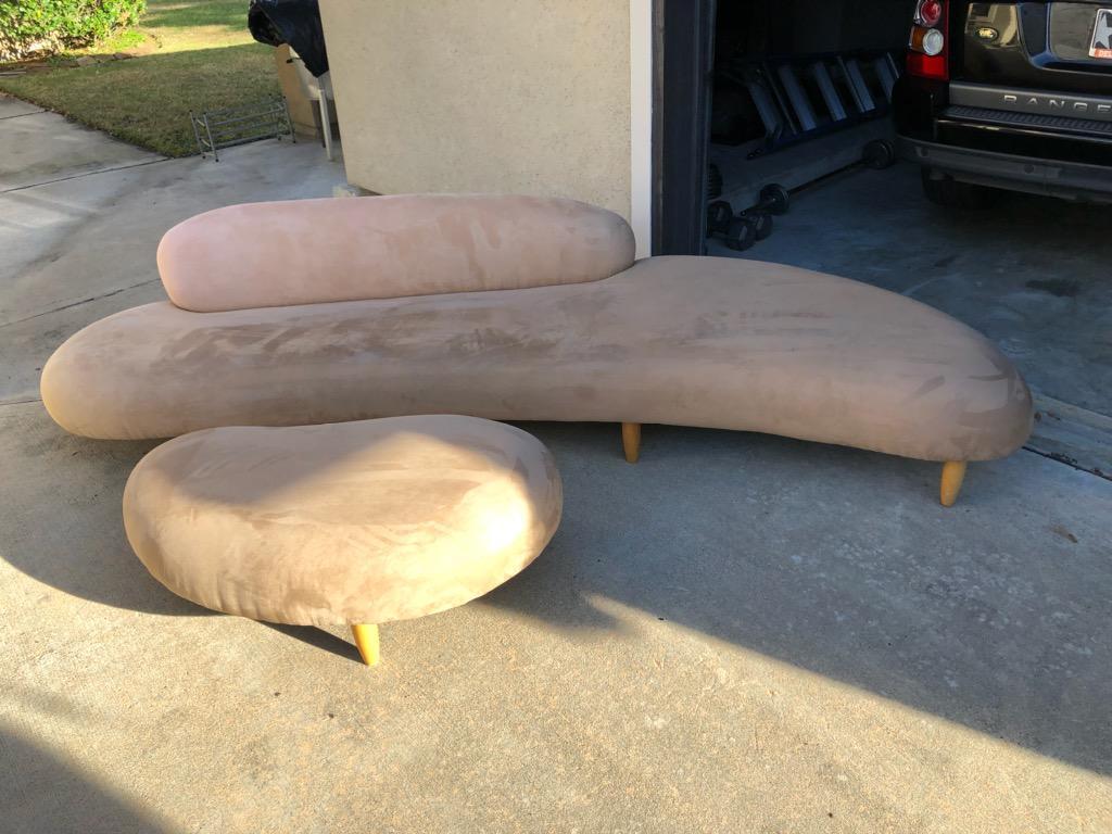 The sculpture quality of Noguchis design finds expression in the freedom form. The ottoman is formed flat large river stone the compliments the sofa. Its rare design separates him from all other. The organic forms are fluid and graceful. 