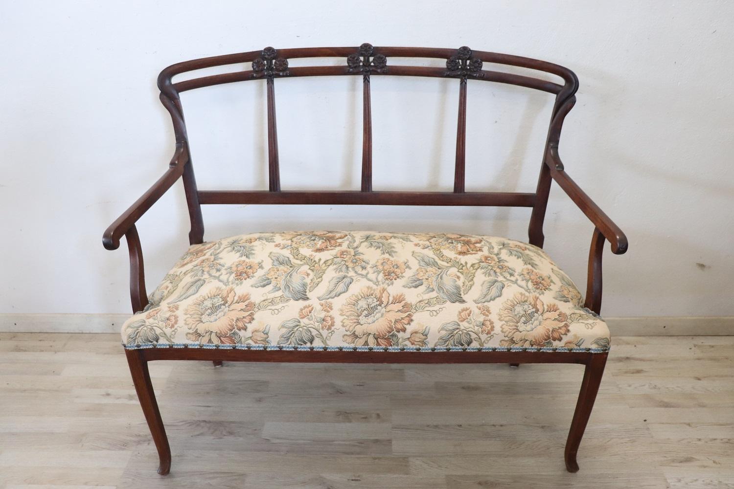 Rare complete Italian Art Nouveau 1900s living room set includes:
1 sofa
2 armchairs
2 chairs

Refined living room set in carved beech wood. The wood has an elegant carved decoration with wavy lines and floral elements typical of the Art Nouveau