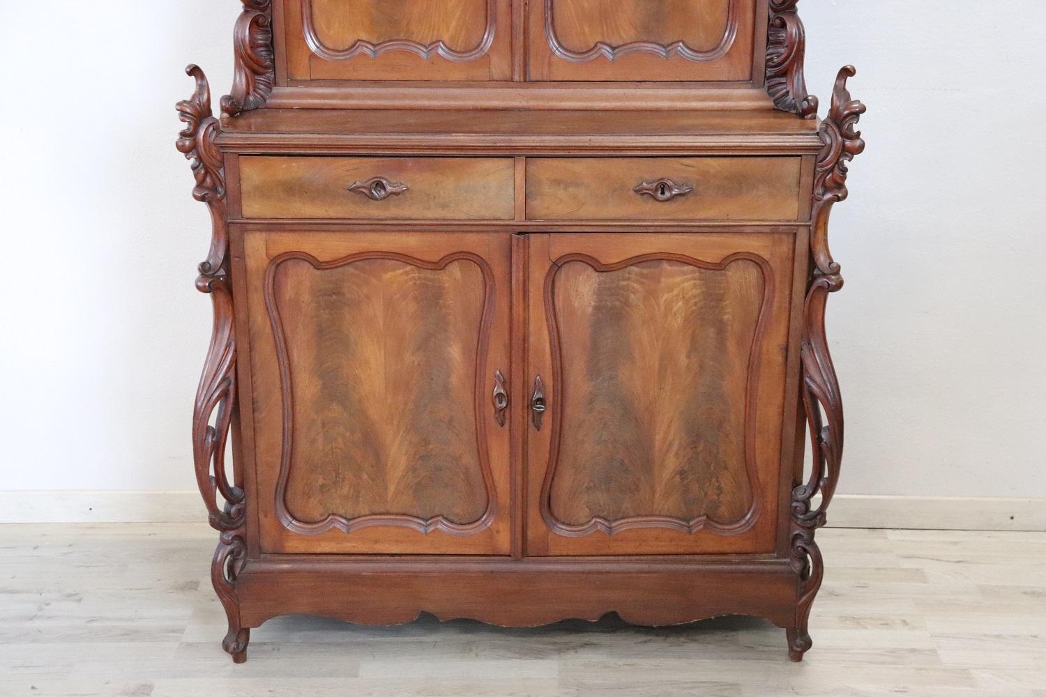 Beautiful art nouveau sideboard in solid mahogany wood made in 1890s. Beautiful patina of wood. Characterized by a refined decoration move with curls and scrolls carved in the wood. The sideboard expresses all the characteristics of the Art nouveau