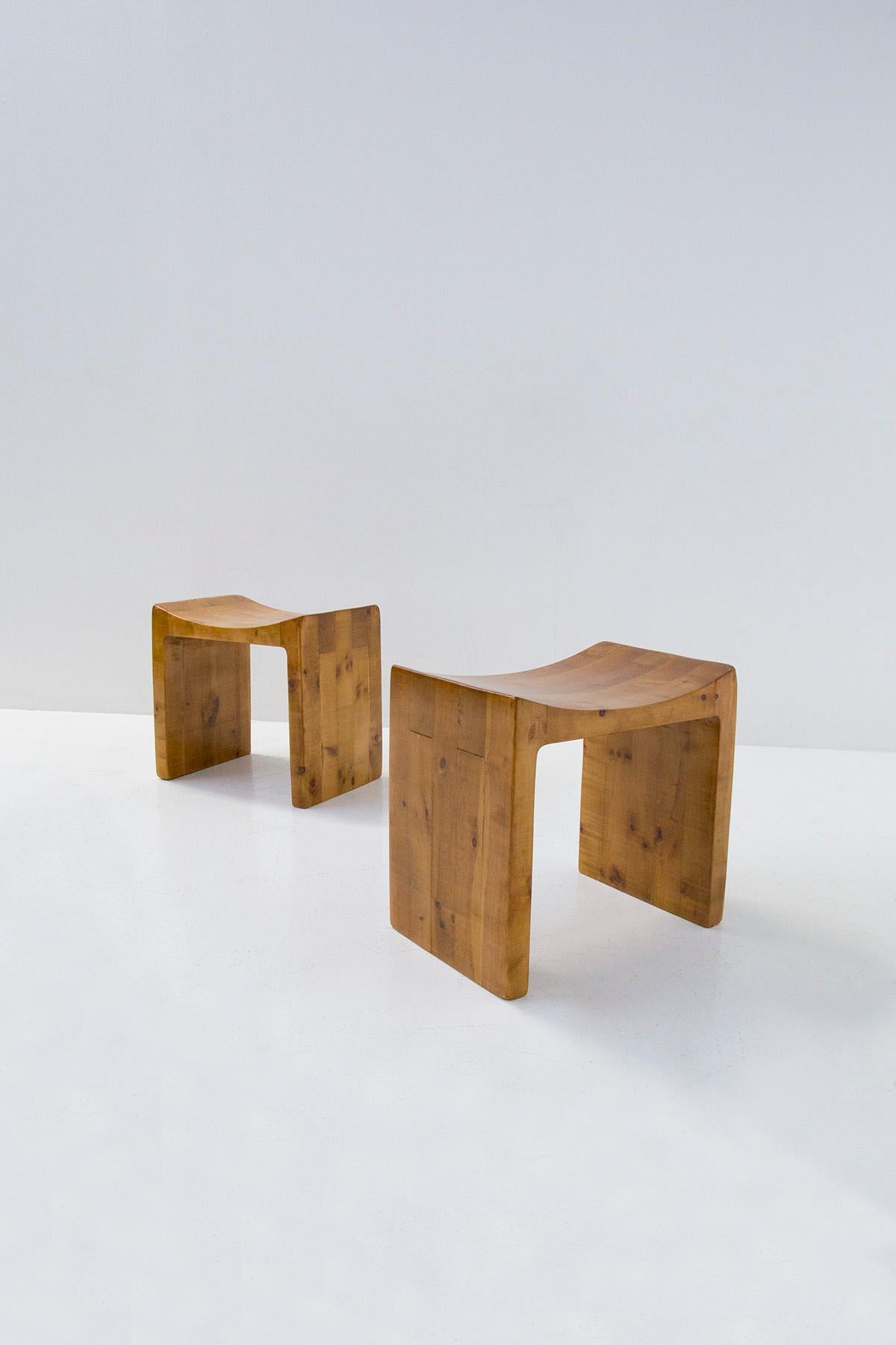Rare Italian bench by Giuseppe Rivadossi from the 1970s. The bench is made entirely of wood. Its construction is a perfect interlocking of noble wood inserts. Great mastery in woodworking. The bench has a simple but at the same time imposing shape