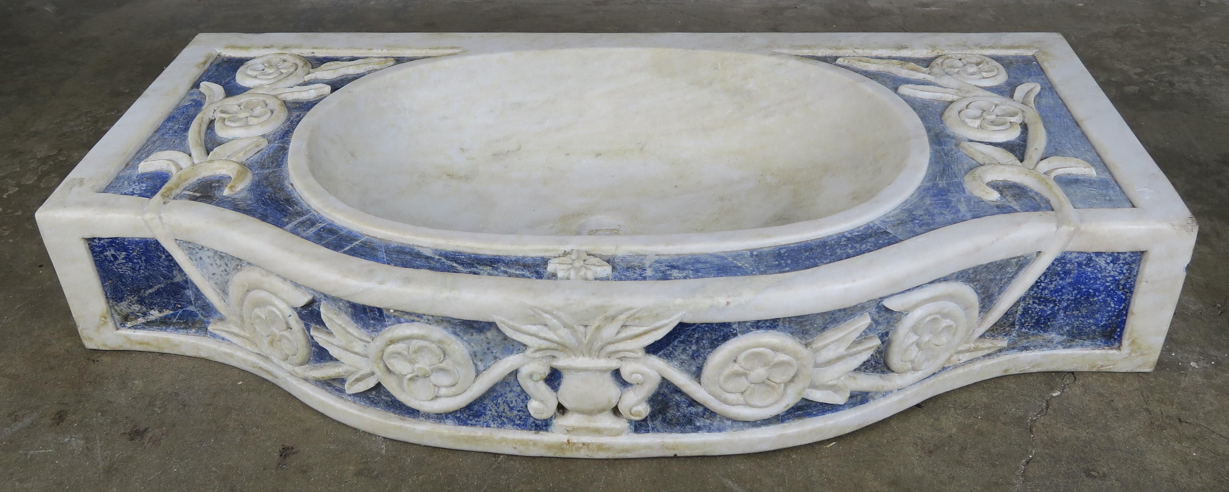 Rare Italian cobalt blue and white Carrara marble stone sink. The sink depicts a centre urn flanked by scrolls of flowers.