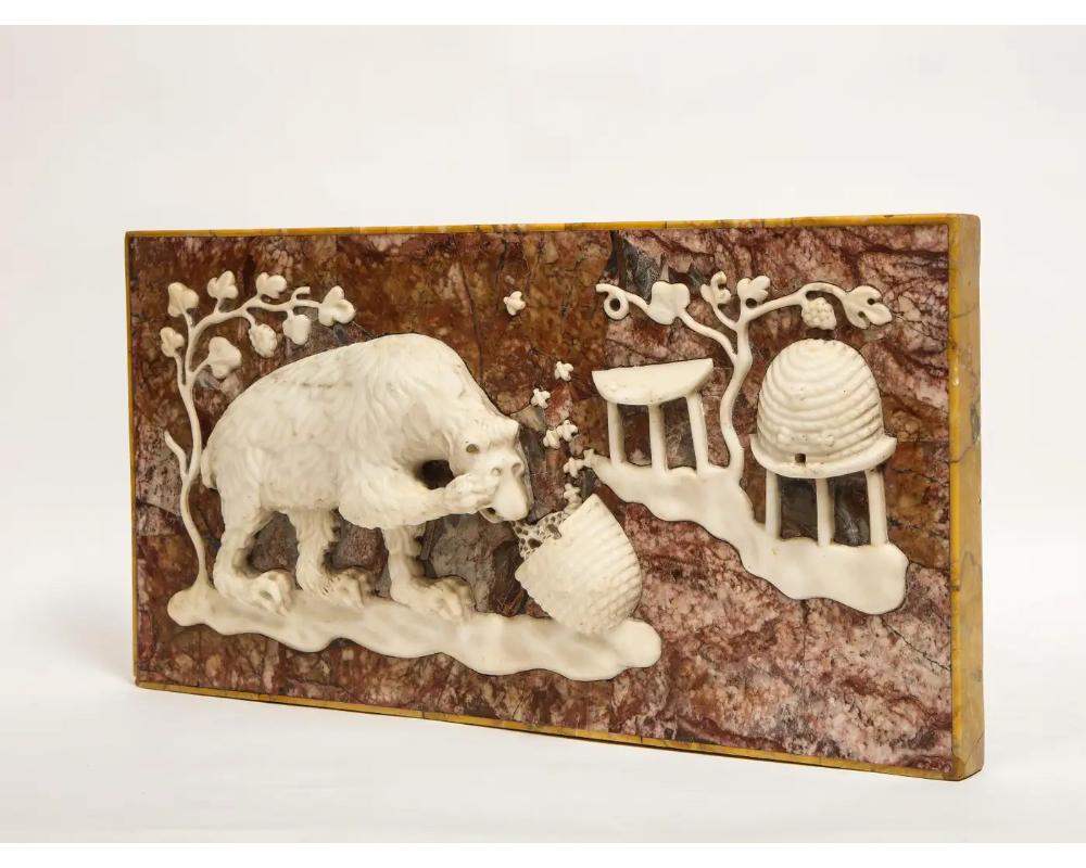 A rare and unusual Italian grand tour marble frieze panel of a bear eating honey, circa 18th/19th century.   

This panel is hand-carved from sienna, rouge, and white marble. It's carved relief depicts a bear eating from a jar of honey.  

Measures: