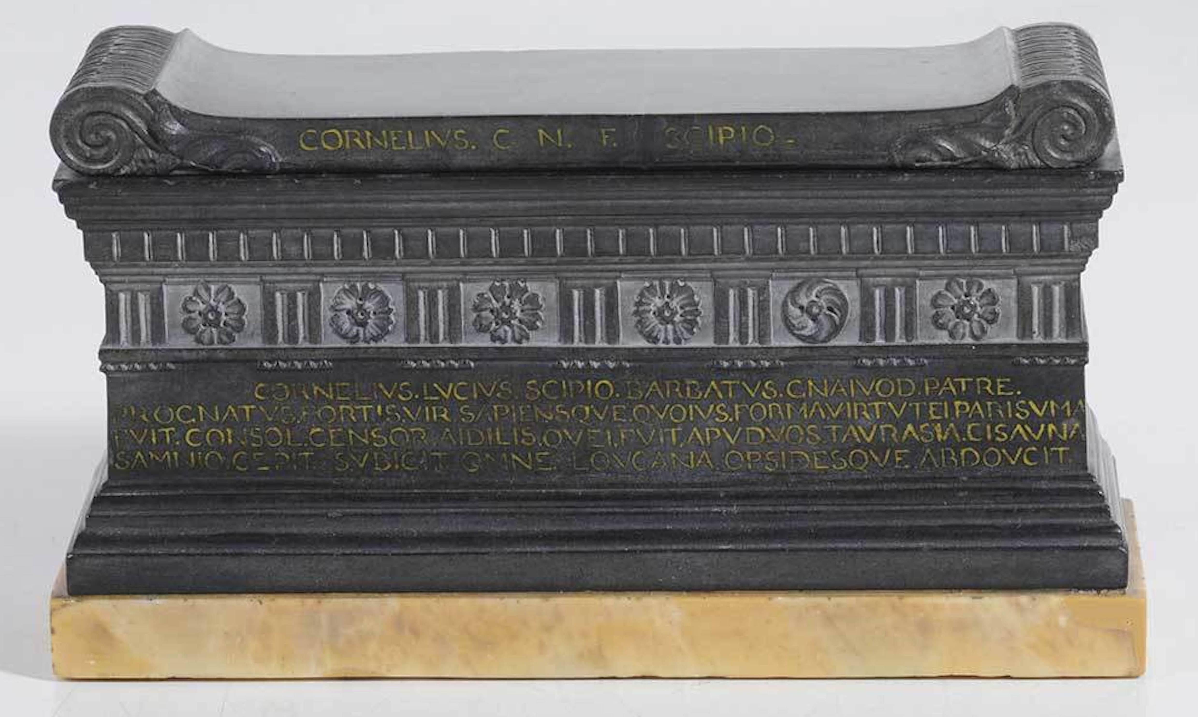 A rare early 19th century Italian Grand Tour model of the tomb of Roman consul Lucius Cornelius Scipio Barbatus, the sarcophagus of rectangular form in carved solid Belgian black marble (Nero del Belgio), the lid with acanthus-scrolled ends, the