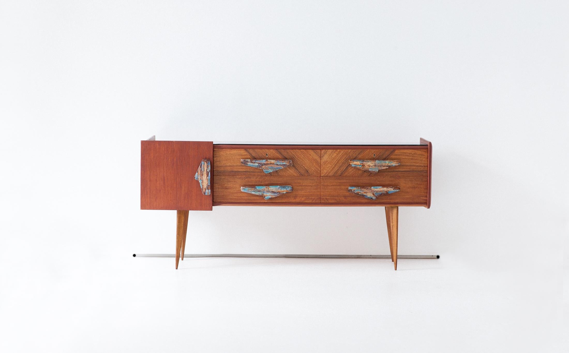 Rare Mid-Century Modern sidebaord with chest of drawers, Italy, 1950s.

An incredible collection of modern and light lines combined with handmade decoration typical of the most unique Italian design furniture of the 1950s.

We have dedicated