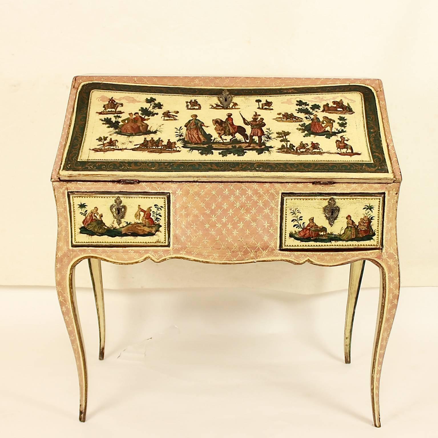A rare mid-18th century Lacca Povera desk or bureau, profusely decorated with decoupage vignettes on the fall front, the sides and the two drawers. Each panel is enclosed by a running floral design on a dark blue ground. The panels depict orientally