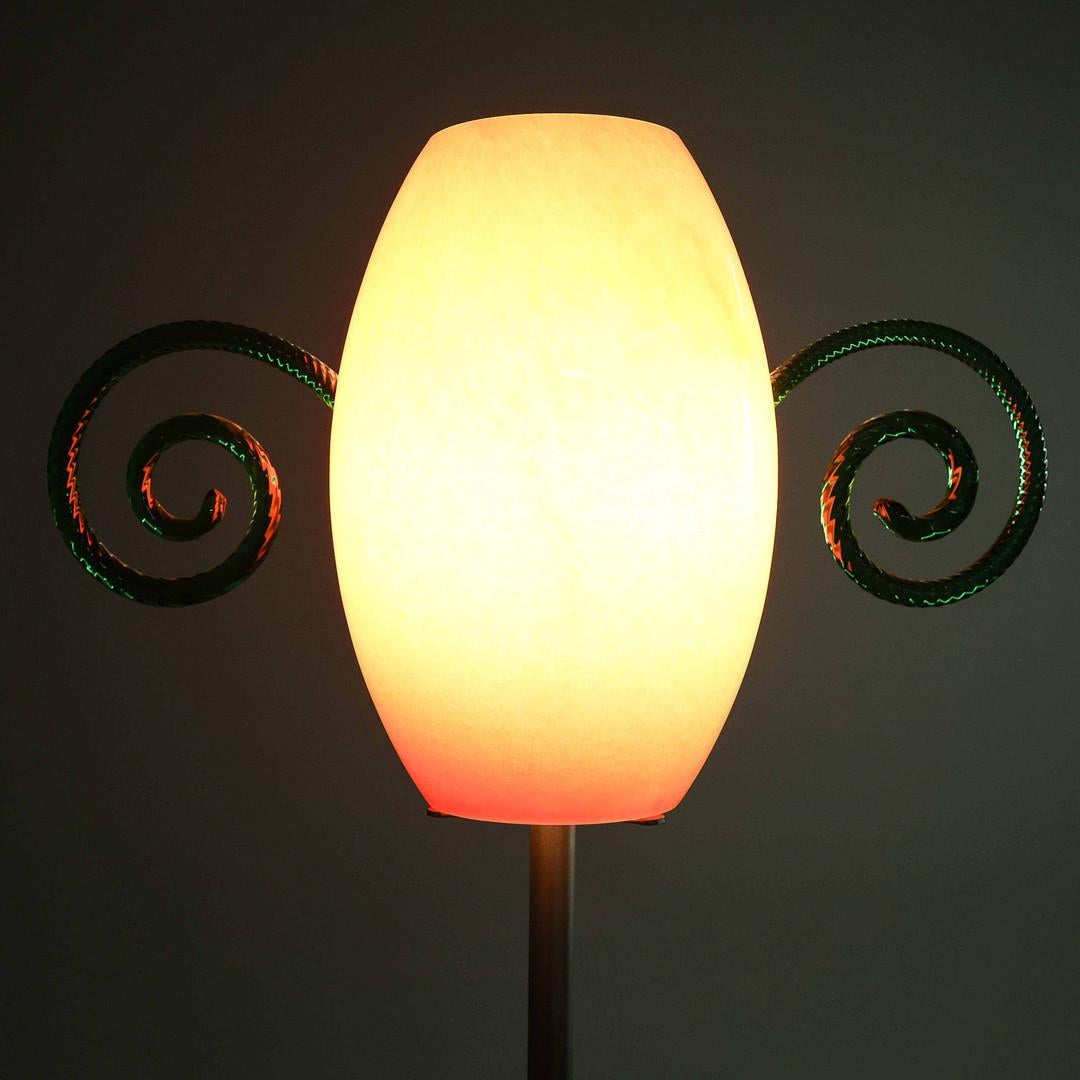 A Floor Lamp Created By The Acclaimed  Italian Glass Designers Barovier & Toso.

The  Murano Floor Lamp Has Been Crafted With Hand Blown Green Glass Whirls On A Red Glass Shade.

Makers Label Attached 

The creations of Barovier&Toso are