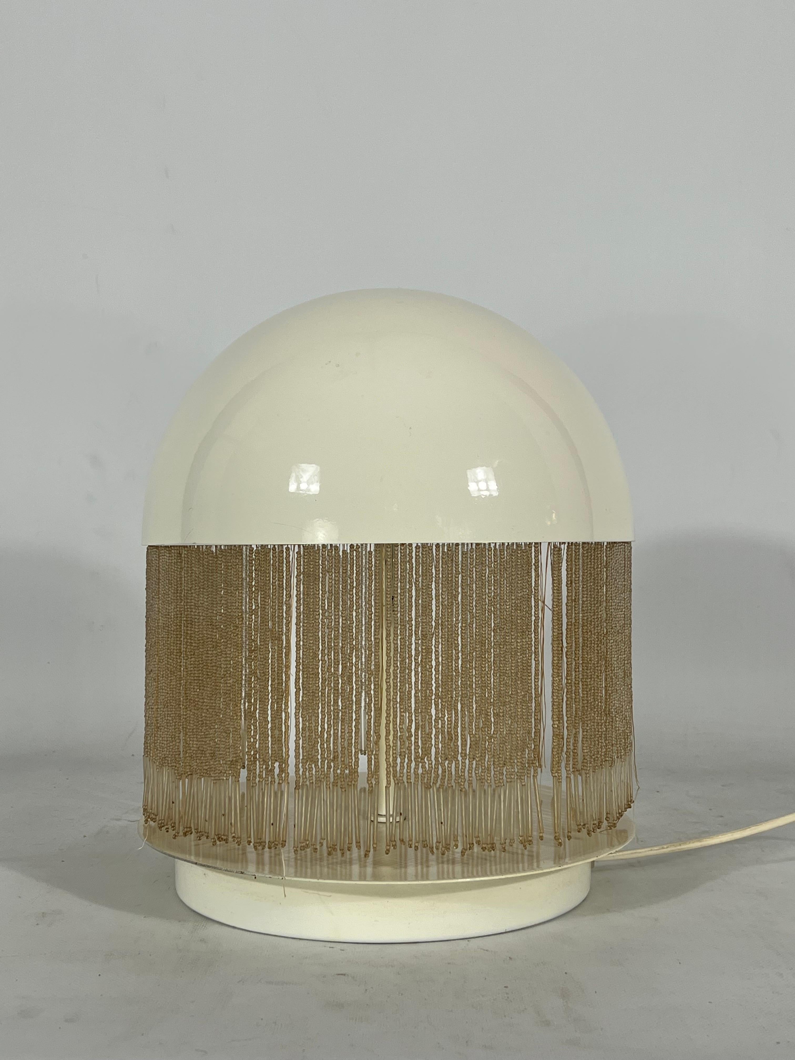 Rare Otero table lamp by Giuliana Gramigna for Quattrifolio. White painted metal structure and glass beads shade. Good vintage condition with trace of age and use. Some loss of beads. Full working with EU standard, adaptable on demand for USA
