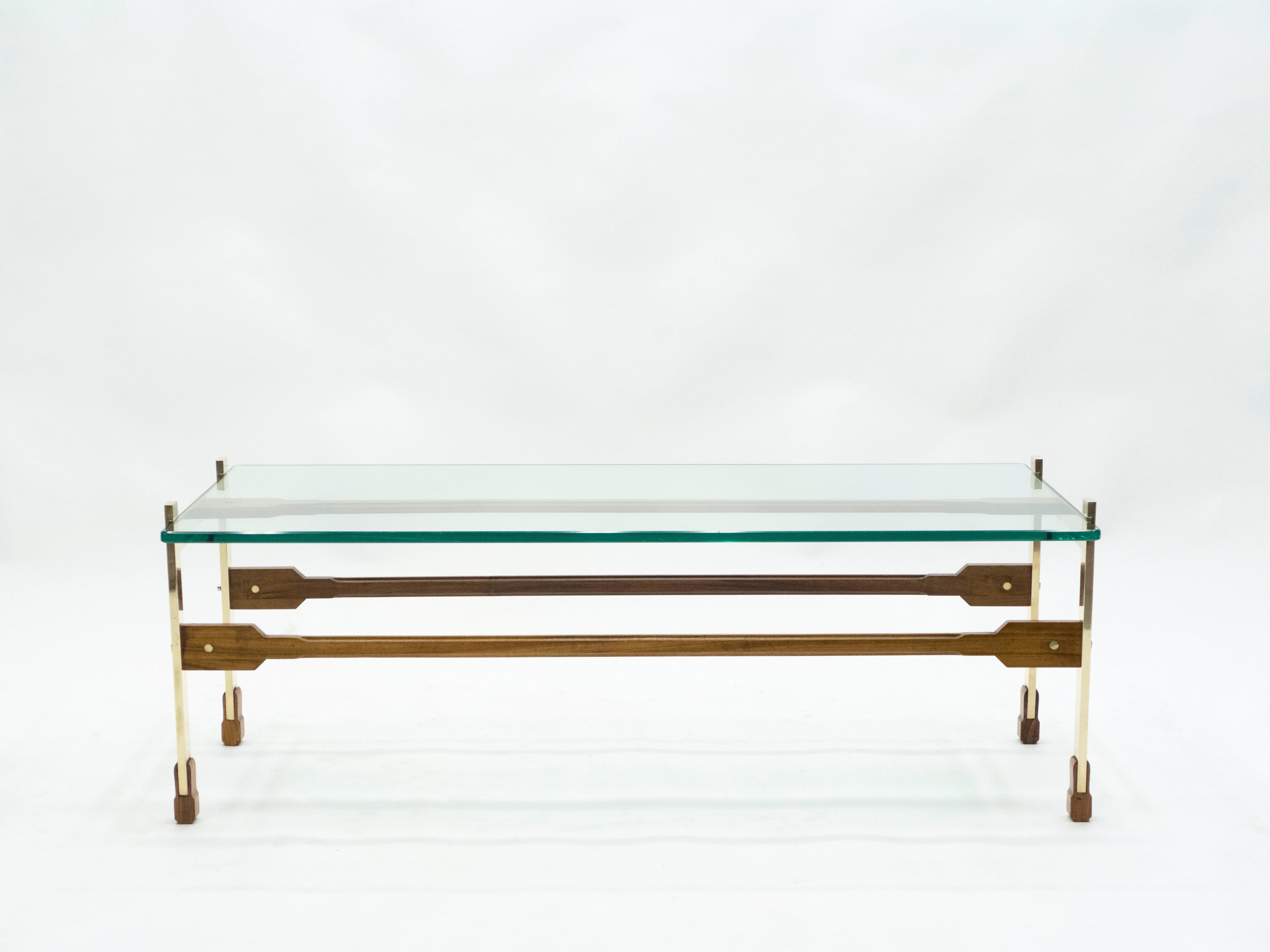 This table made by Santambrogio & De Berti, with its polished brass base and feet, and three rosewood sleepers, reflects all the beauty and finesse of Italian Mid-Century Modern design. It is stunning in either modern or Classic interior, and a