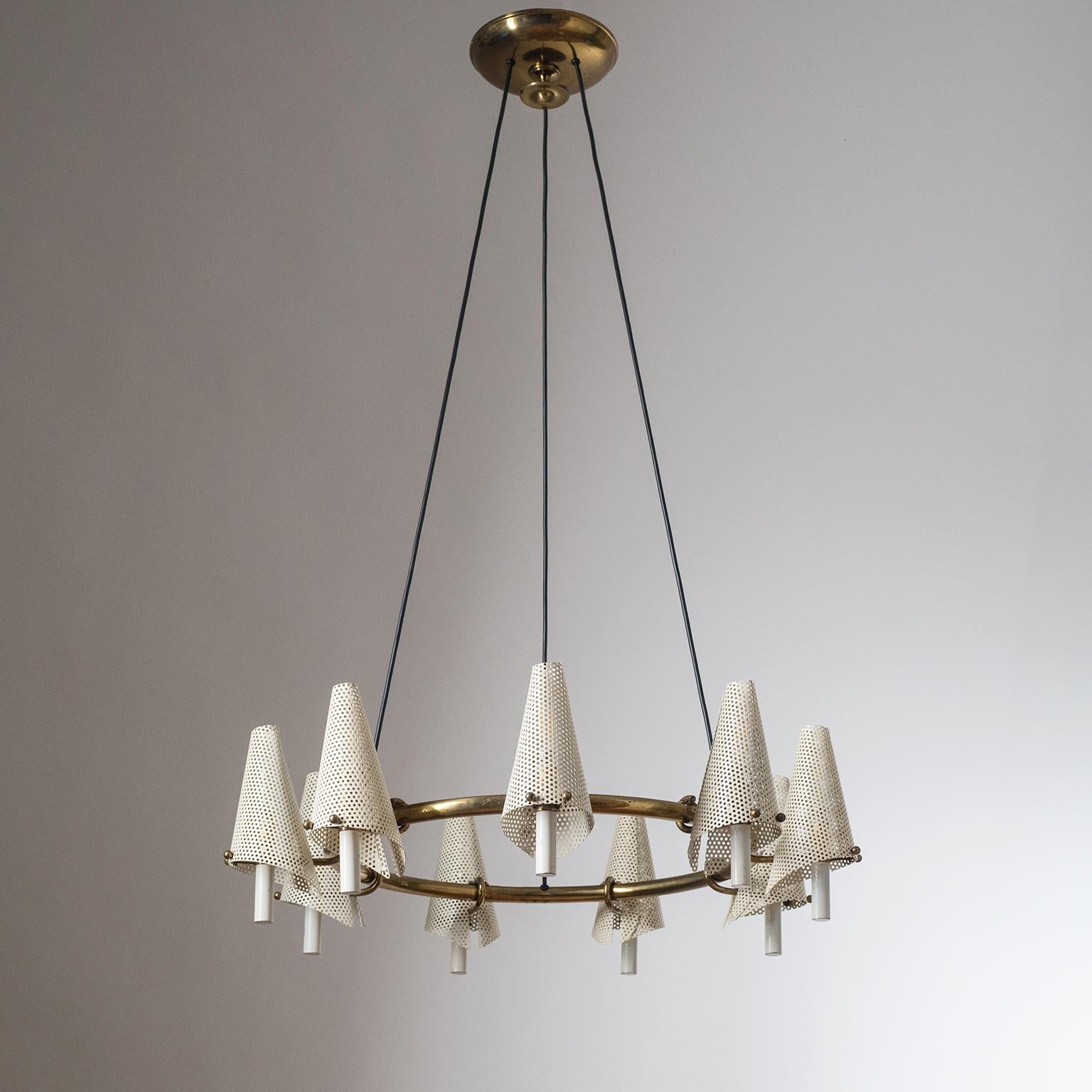 Rare Italian suspension chandelier from the late 1940s. Large brass ring with nine sculptural sconce-like arms with perforated steel shades. This is most likely a custom piece and therefore unique. Nine brass and ceramic E14 sockets with new wiring.