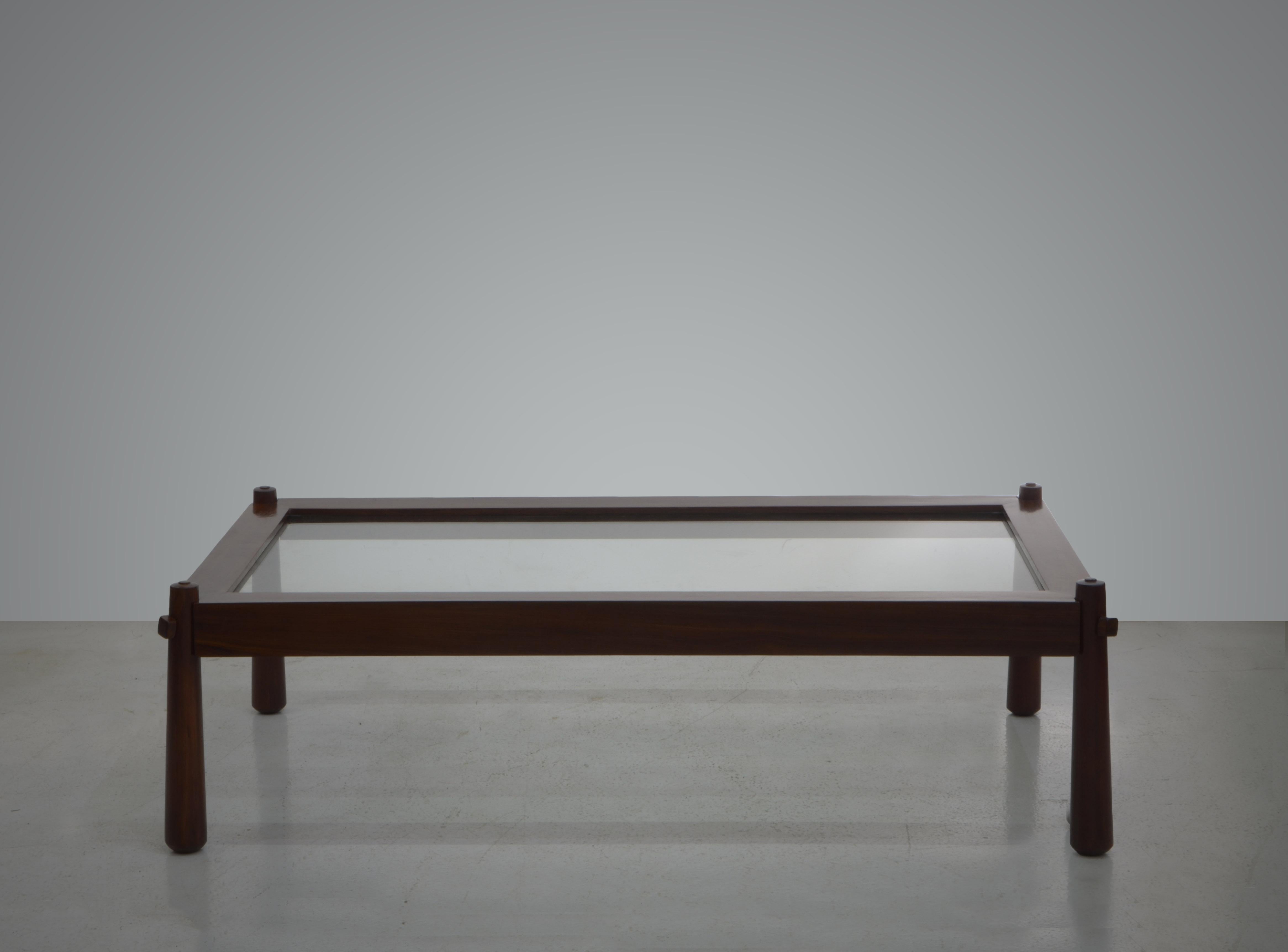 The Mp-81 coffee table is capable of bringing a sense of personality and style to any decor. The Brazilian hardwood structure is sculpted beautifully and it is a great example of the way Percival Lafer use to treat the wood in his creations. The