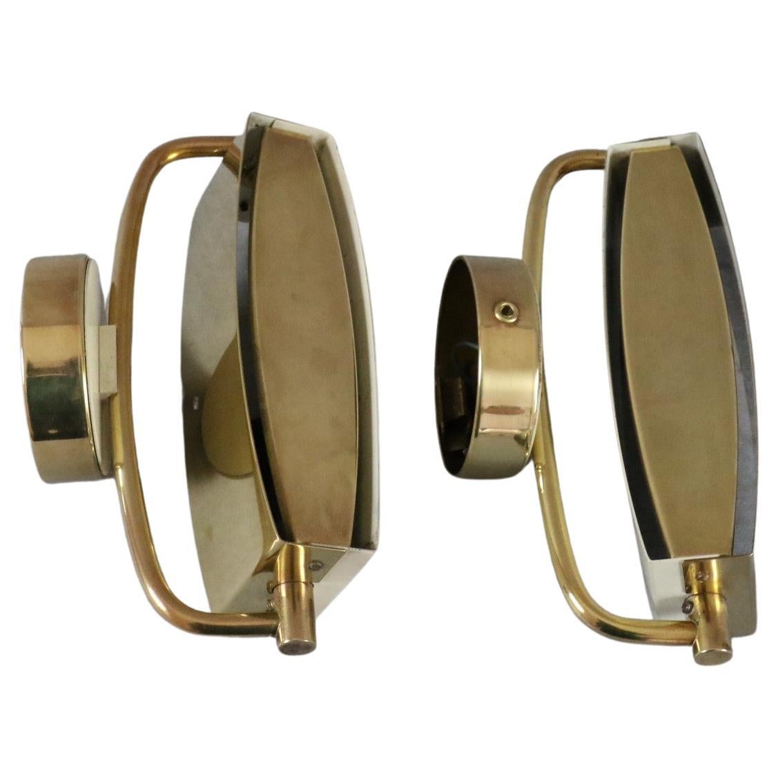 Rare Jacques Biny - pair of mid-century sconces circa 1950 Era Perriand, Guariche

Wonderful French bedside lamps by Jacques Biny, shade and backplate in brass & enameled metal, adjustable along the horizontal brass axis, brushed brass front plate.