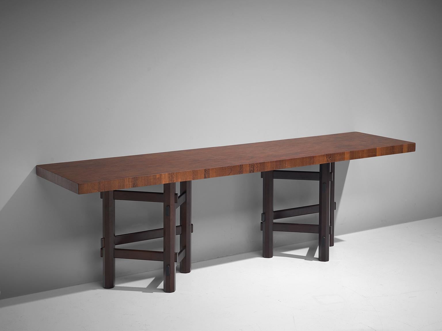 Jan Vlug, console, wengé and mahogany, Belgium, 1970s

Rare and exclusive console table with characteristic graphical base and stunning made table top. The base is made of lacquered mahogany wood. It consists of two elements, build up from 3 legs