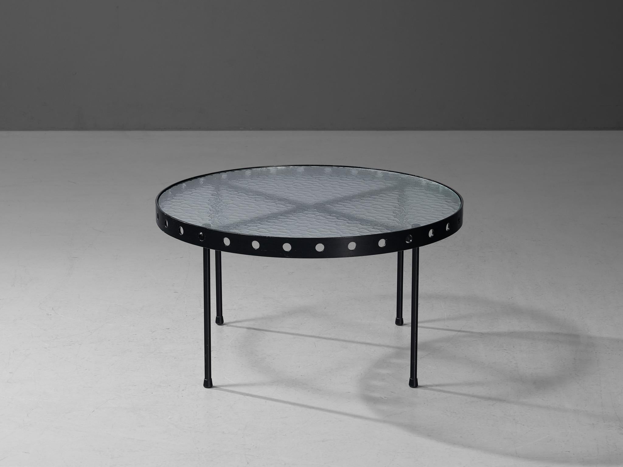Janni van Pelt, coffee table, enameled metal, textured glass, plastic, The Netherlands, 1950s

This unique coffee table by Janni van Pelt features a round textured glass top with a coated metal border in black that is finished with evenly spaced