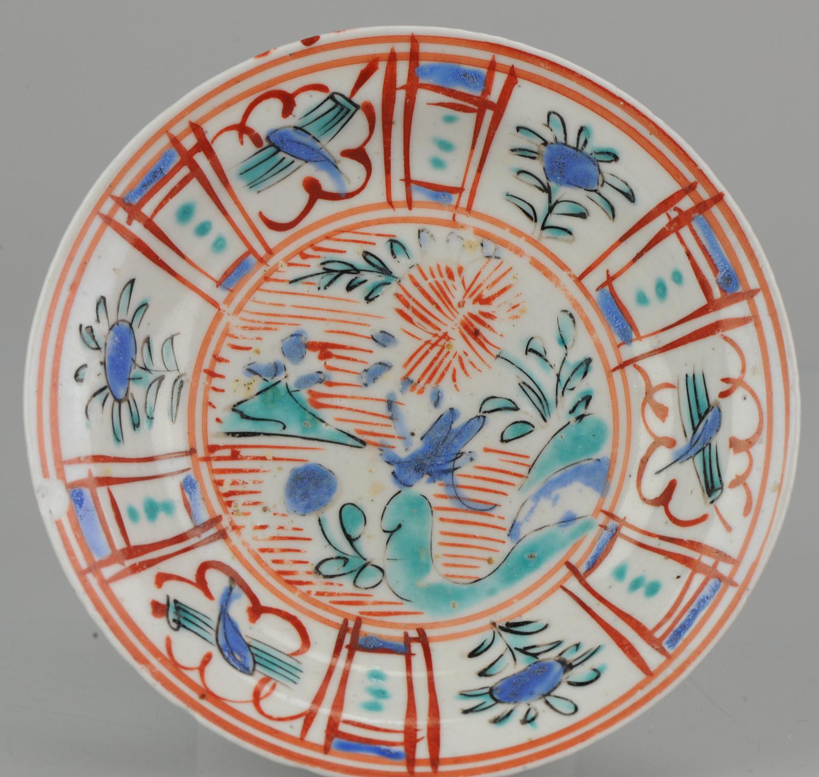 Sharing this lovely little dish from the second half of the 17th century.
It is painted in overglaze enamels in the style of a Chinese Kraak dish. With some imagination a grasshopper is visible in the centre on a rock. A mountain in green is also