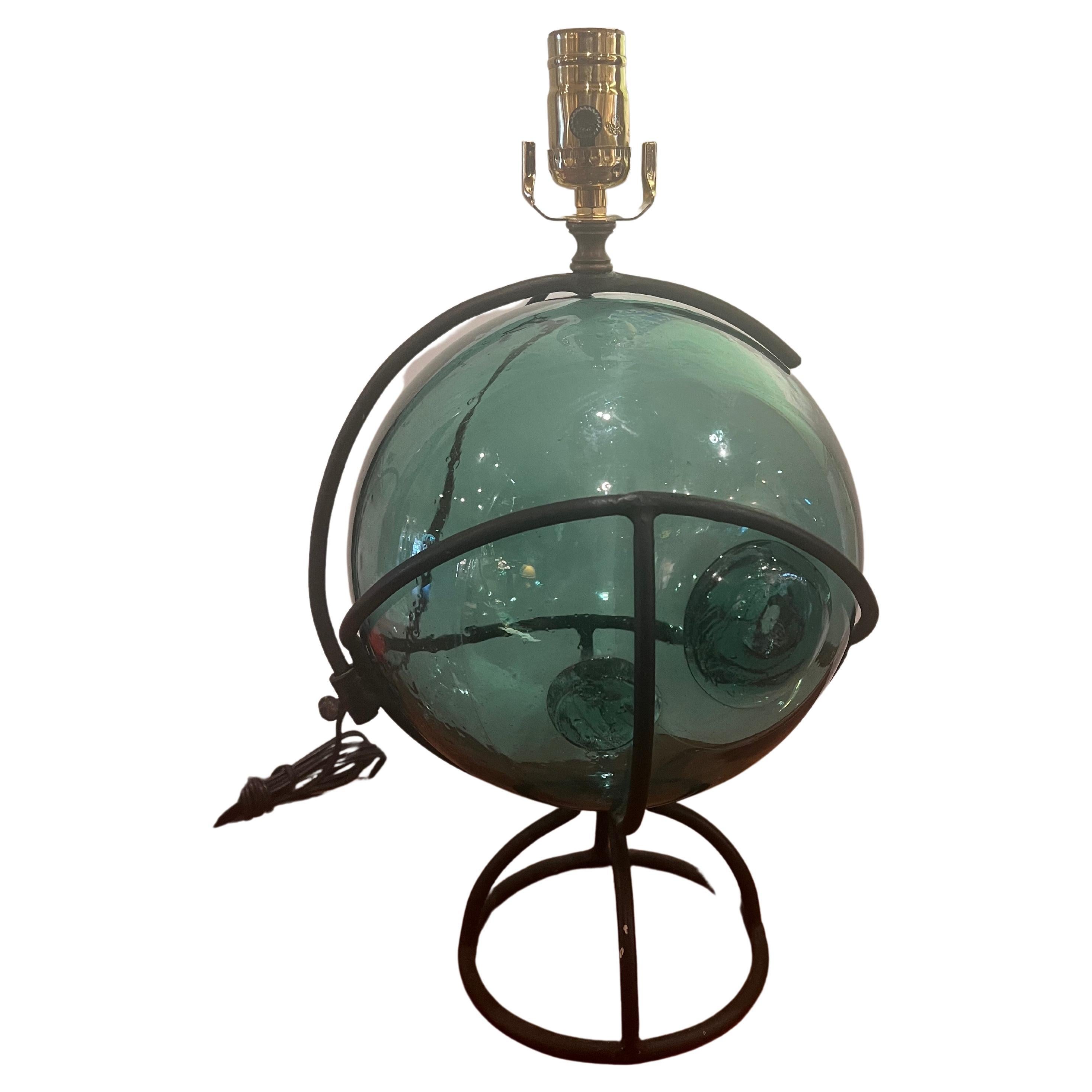 Beautiful and very rare Japanese fishing blown glass ball with special iron frame, freshly rewired new socket and cord lampshade not included it's 18 inches tall to the top of the socket.
