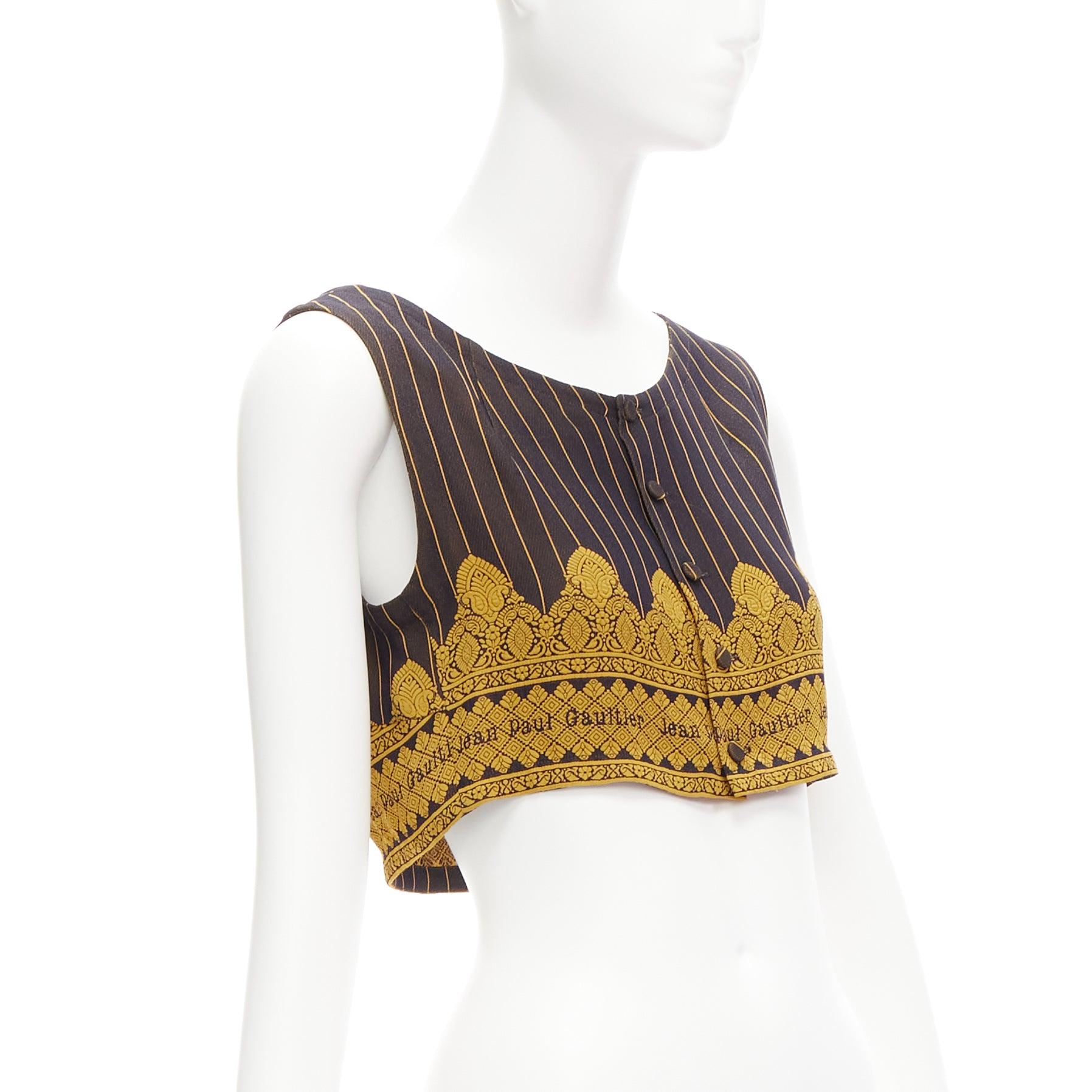 rare JEAN PAUL GAULTIER FEMME Vintage Maharaja brown logo crop top IT40 S
Reference: TGAS/D00999
Brand: Jean Paul Gaultier
Designer: Jean Paul Gaultier
Collection: Femme
Material: Rayon, Blend
Color: Yellow, Brown
Pattern: Ethnic
Closure: