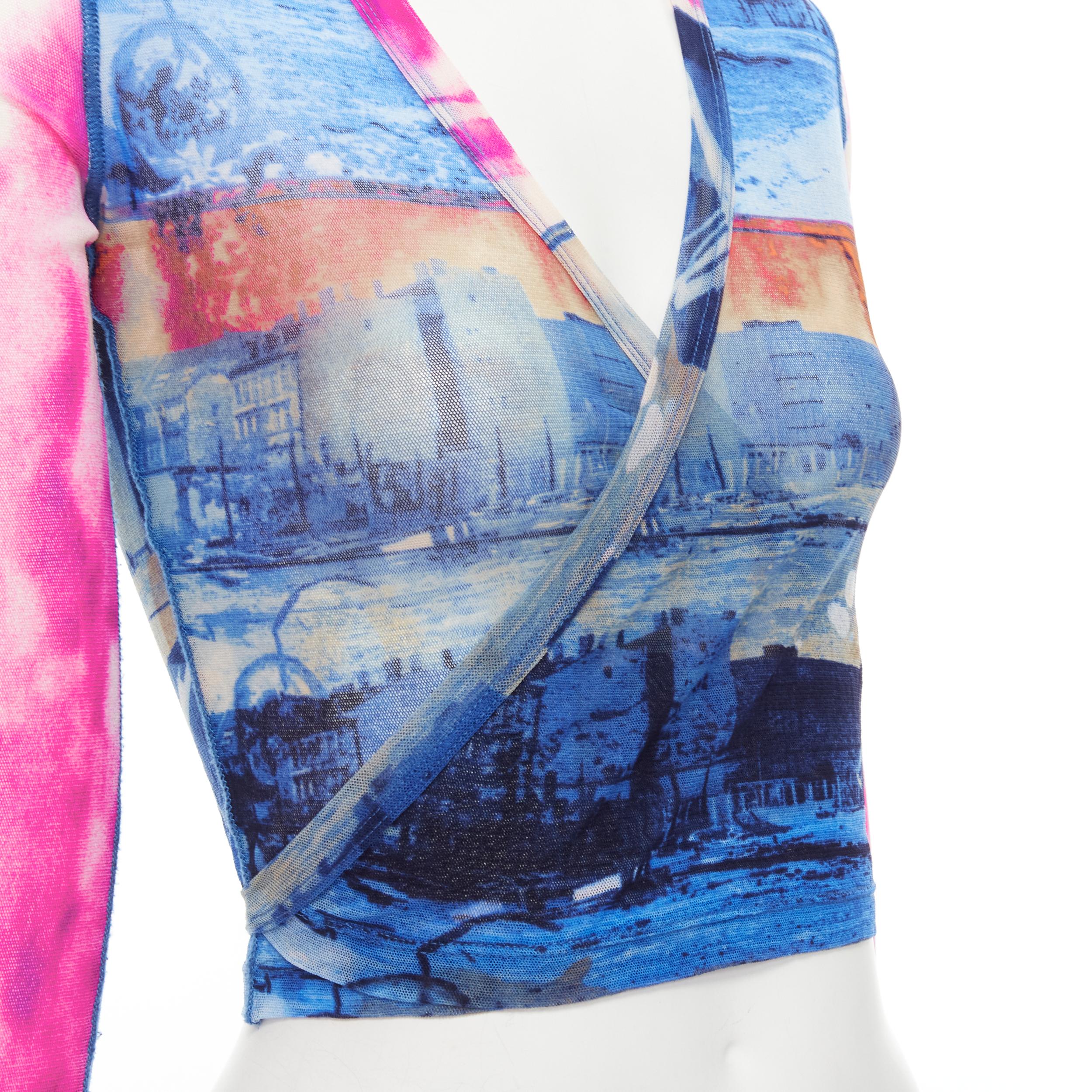rare JEAN PAUL GAULTIER Soleil Vintage blue pink cityscape sheer wrap top S 
Reference: TGAS/C01039 
Brand: Jean Paul Gaultier Soleil 
Designer: Jean Paul Gaultier
Material: Polyamide 
Color: Blue 
Pattern: Cityscape 
Closure: Wrap 
Extra Detail:
