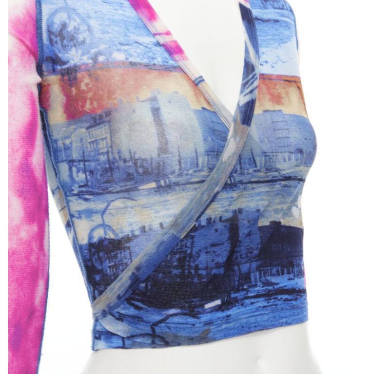 rare JEAN PAUL GAULTIER Soleil Vintage blue pink cityscape sheer wrap top S
Reference: TGAS/C01039
Brand: Jean Paul Gaultier
Designer: Jean Paul Gaultier
Material: Polyamide
Color: Blue, Pink
Pattern: Cityscape
Closure: Wrap Tie
Extra Details: Self