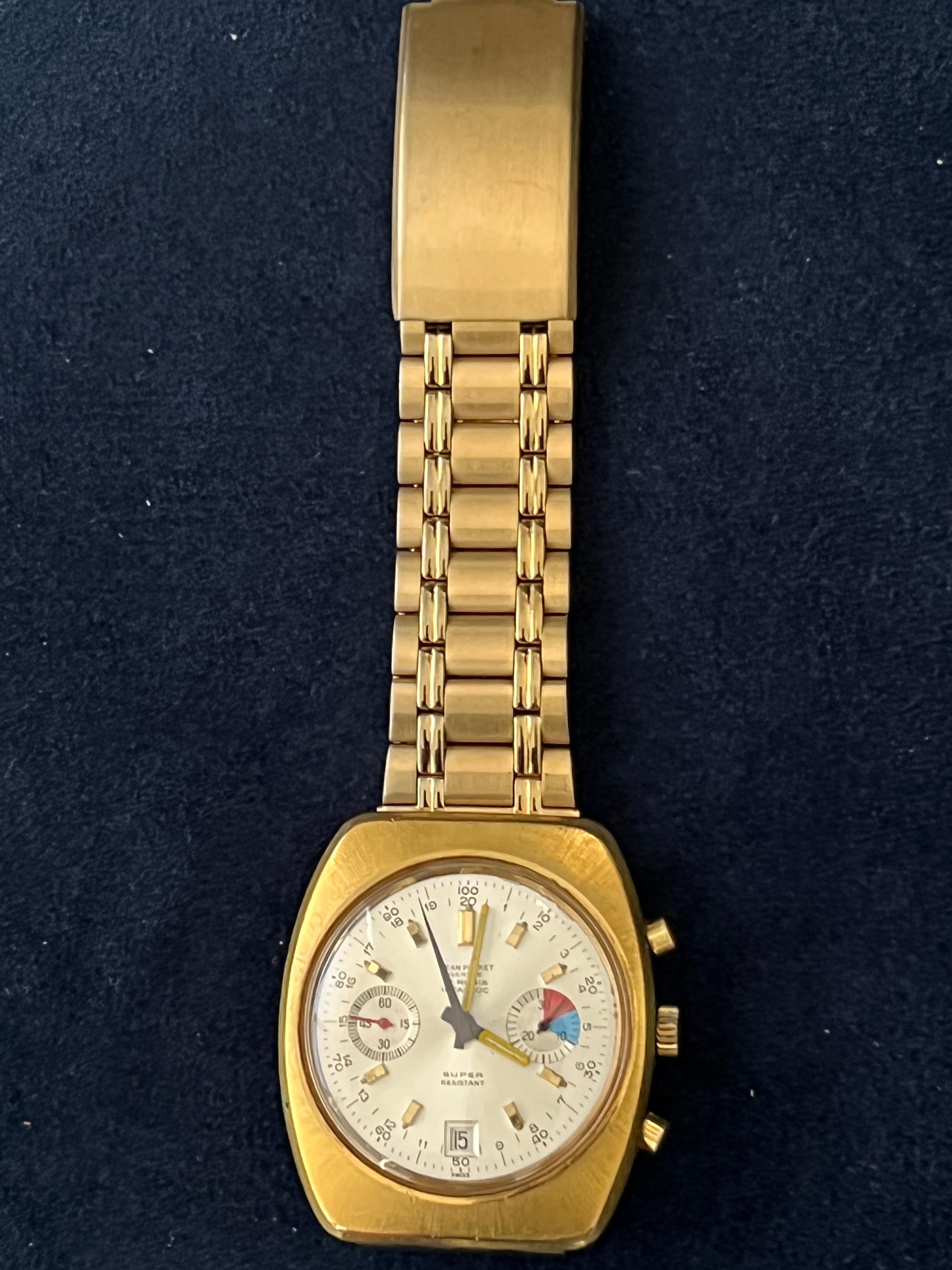 Rare Jean Perret Geneve  QJ 3826 Gold Plated & Stainless Steel Quartz Men's Watch in mint condition. First owner from a private collection. The mate finish gold bracelet and case are just to die for.
17 Rubies 
Sport 
Stopper 
Super Resistant 
Water