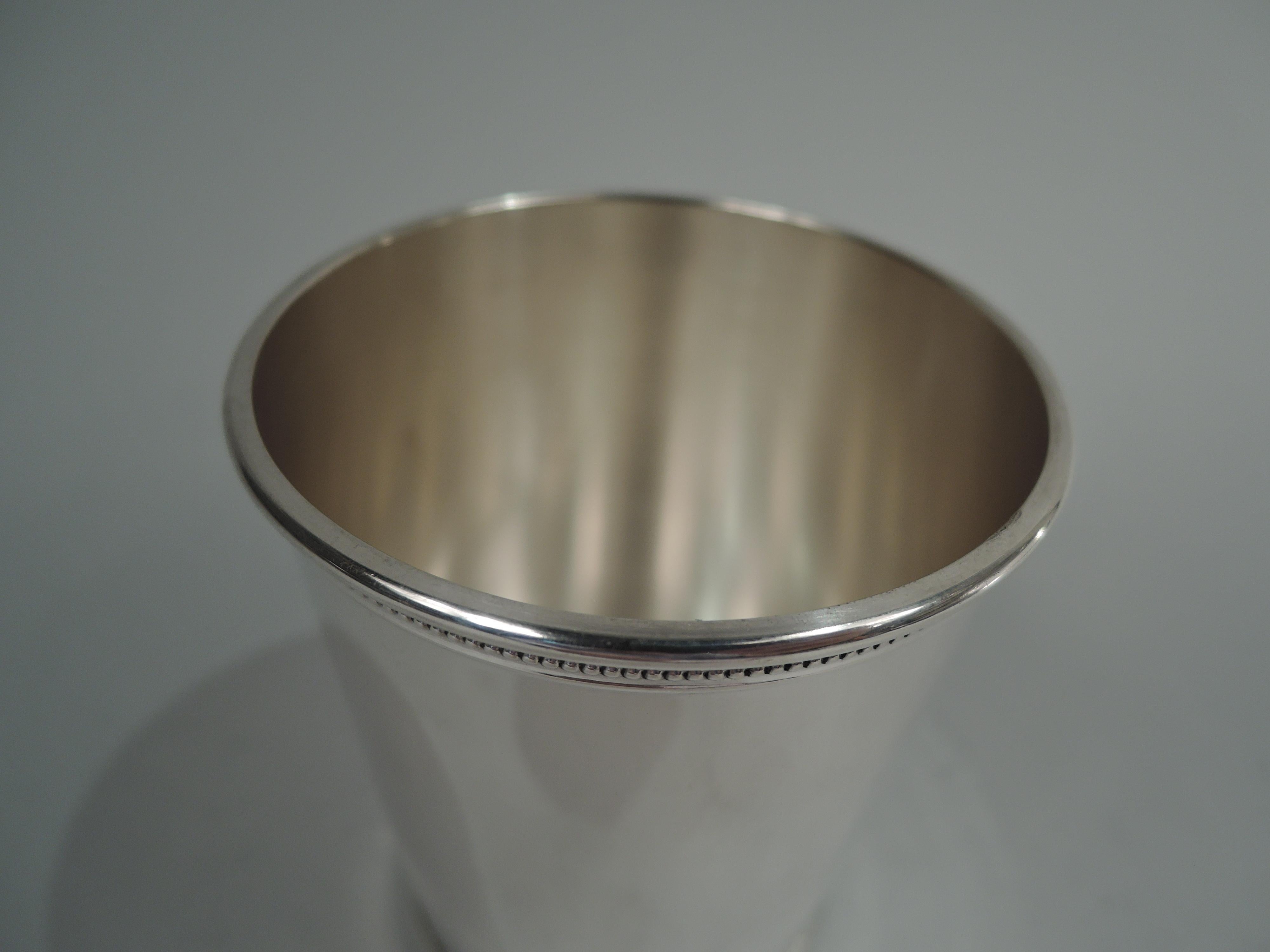 JFK-era sterling silver mint julep. Retailed by Scearce in Kentucky. Traditional form with tapering sides and beaded rims. A hard-to-find cup from Kennedy’s incomplete single term (1961-3). Fully marked including retailer’s stamp and presidential