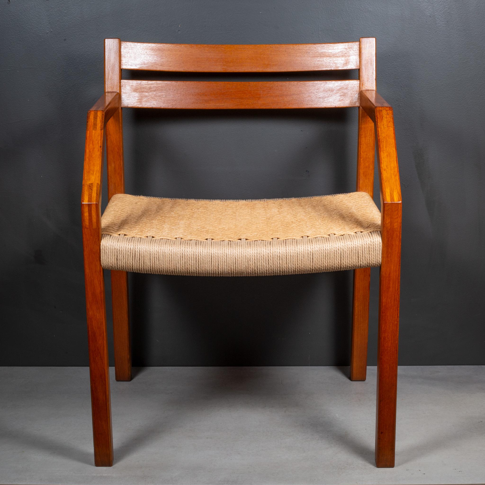 ABOUT

May sell separately. Price is per chair.

A pair of rare J.L. Moller Model #404 dining/desk armchairs, designed in 1974 by Jorgen Henrik Moller for J.L. Moller Mobelfabrik of Denmark. The chairs are crafted of solid teak and paper cord seats.