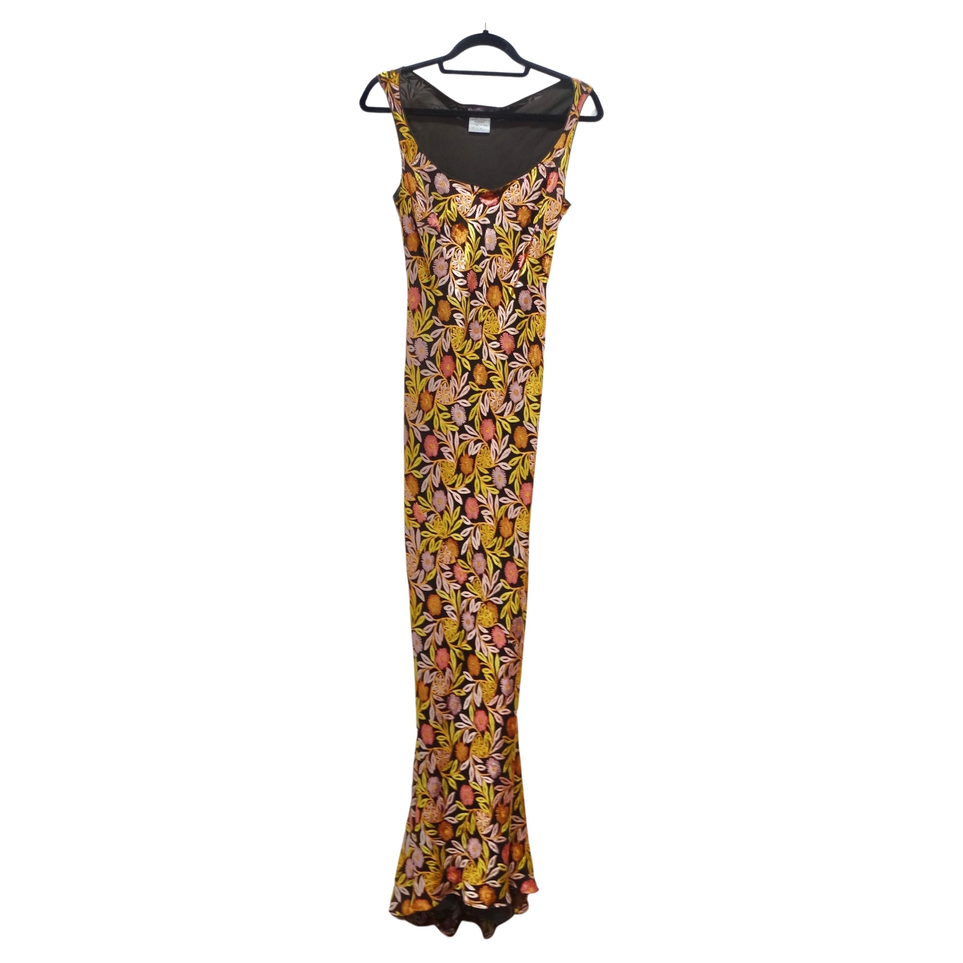 Introducing a truly remarkable piece of fashion history: this rare early 2000s John Galliano bias cut maxi dress. This dress showcases the epitome of timeless elegance, combining the allure of the past with a touch of contemporary sophistication.