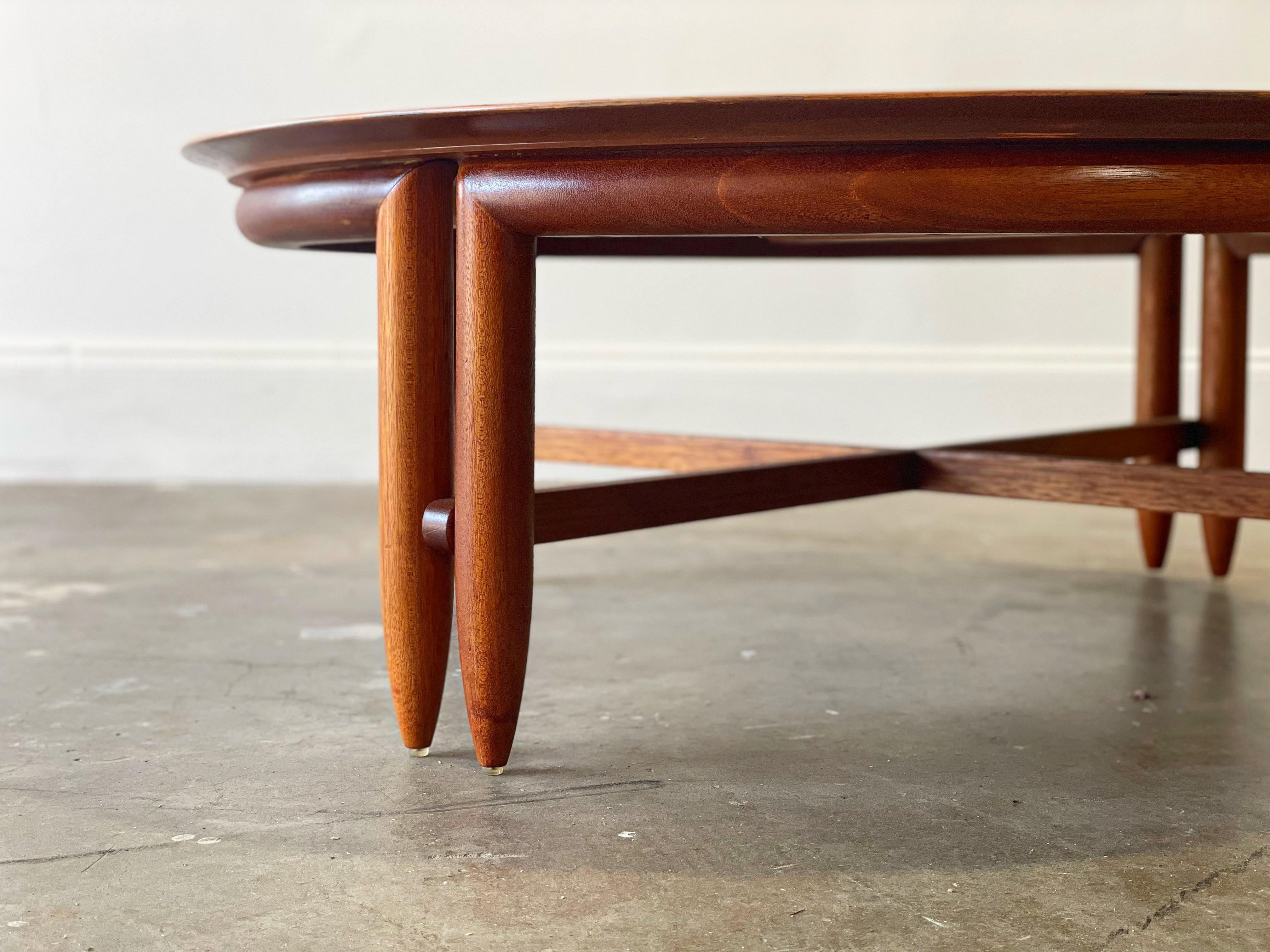 Rare torpedo leg round cocktail designed by John Keal for Brown Saltman, circa early 1950s. This example is unique on the market - we have not been able to find any other documented examples of this particular design. Retains the original 