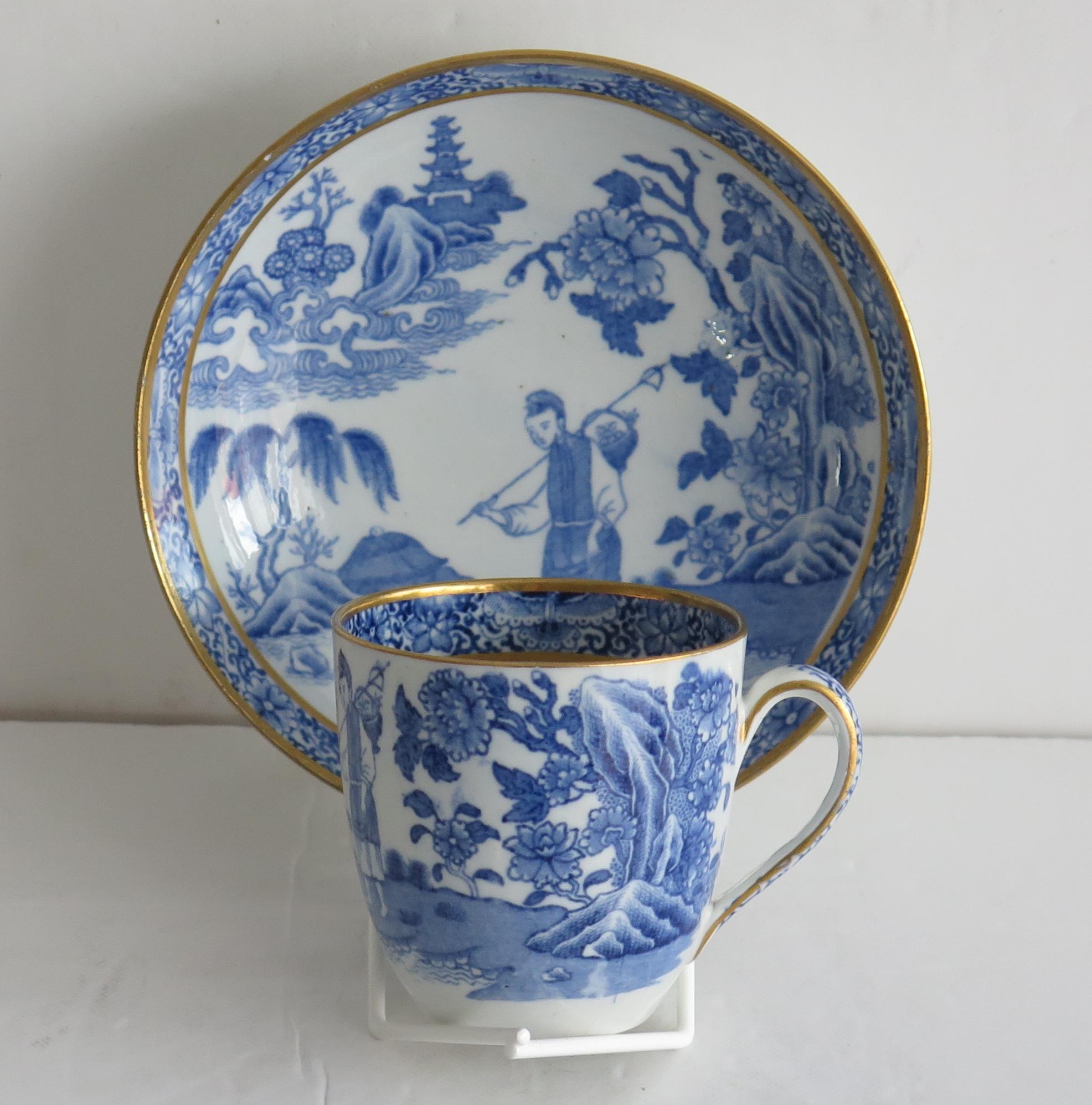 This is a rare coffee cup and saucer in ‘The Traveller’ or ‘One Legged Duck’ blue transfer printed, hand gilded pattern by John Turner & family, of Lane End, Longton, Staffordshire. 

Both pieces are well decorated in a Chinoiserie blue printed