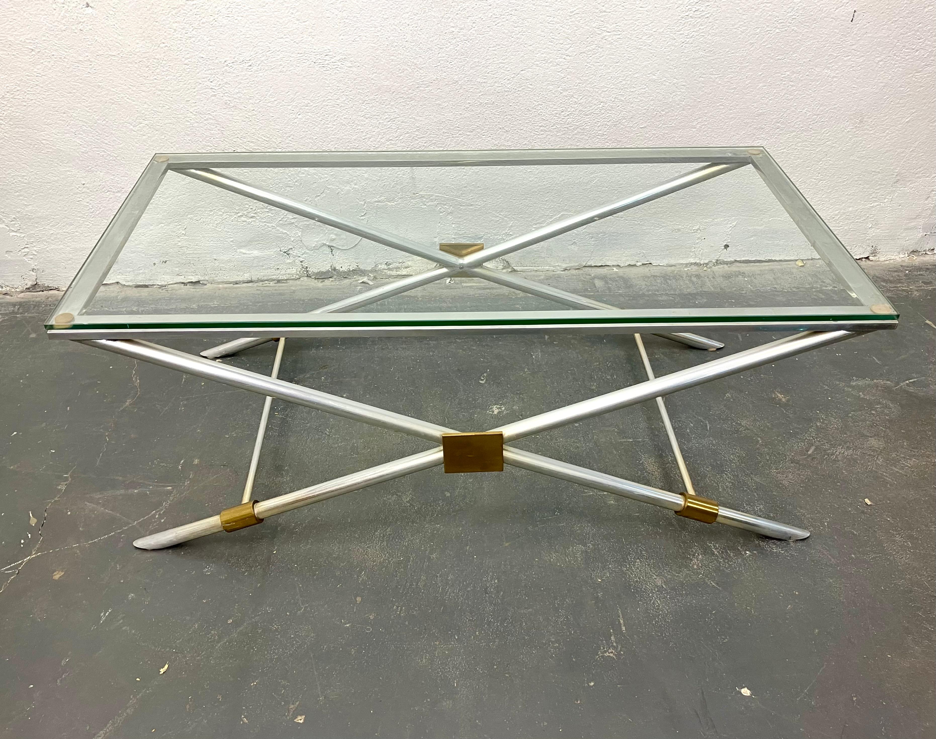 Brass-mounted polished aluminum with 1/2” glass top. Model v-41 from Vesey’s first collection of 1958.
