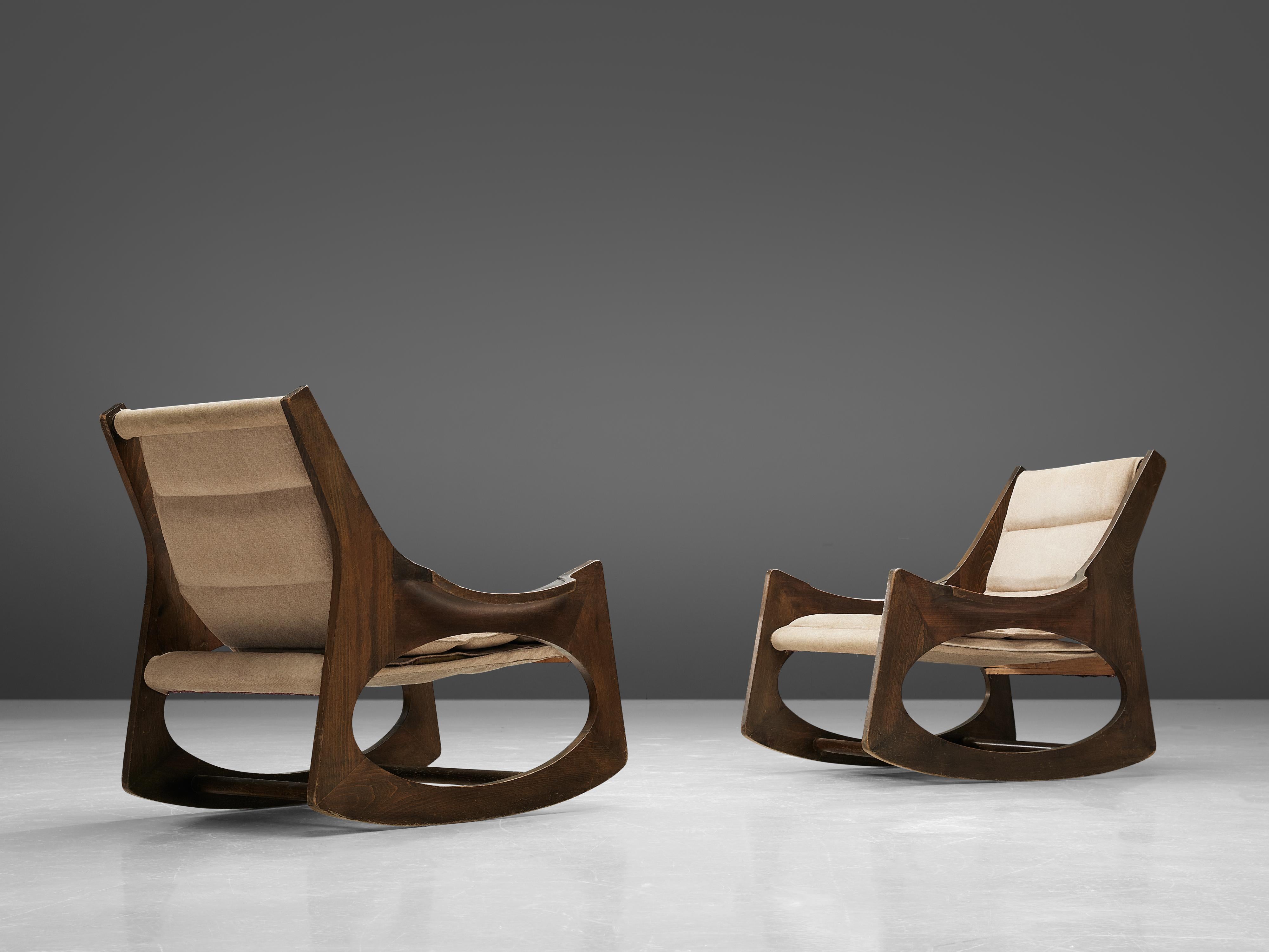 Jordi Vilanova i Bosch,' pair of Tartera' rocking chairs, boxwood, beech, and fabric, Spain, design 1966, manufacture 1960s.

These two wonderful rocking chairs are made of two symmetrical side pieces, which integrate the structure of the backrest,