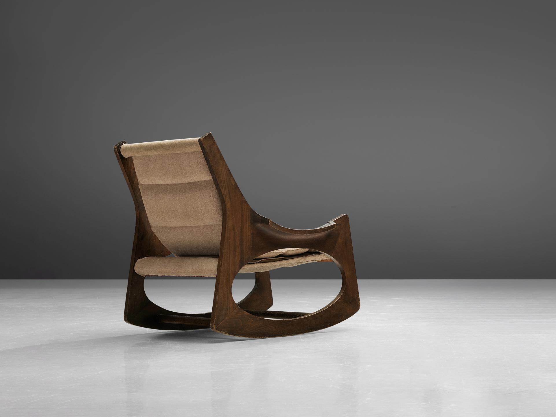 Jordi Vilanova i Bosch,' Tartera' rocking chair, boxwood, beech, and fabric, Spain, design 1966, manufacture 1960s.

This wonderful rocking chair is made of two symmetrical side pieces, which integrate the structure of the backrest, arms, legs and