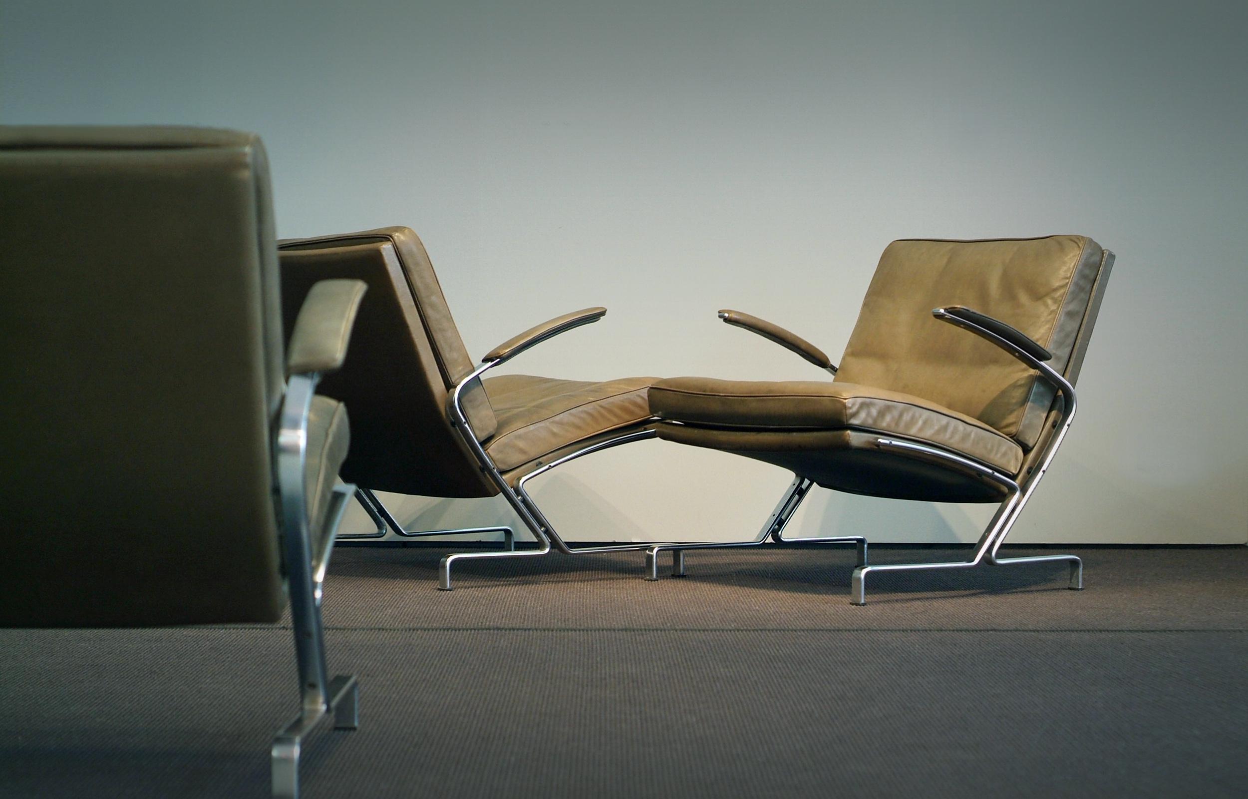 Rare Jørgen Kastholm easy chairs model 730 (2 pieces). Original green/brown leather and matte chromed steel. Produced Kill Int. in the early 1970s. Short production period - ultra comfortable. Wonderful and minimalistic design that matches to any