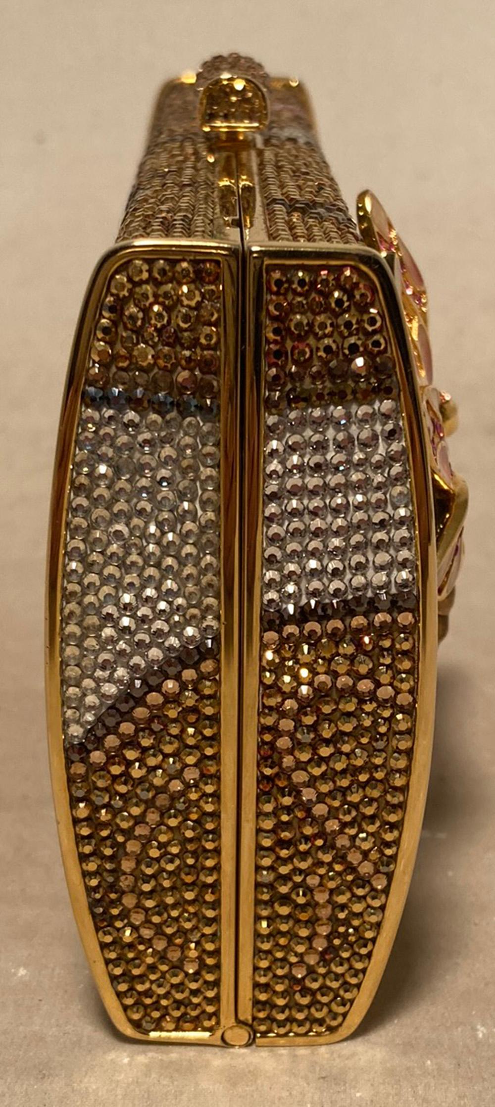 RARE Judith Leiber 45th Anniversary Dragonfly Swarovski Crystal Minaudiere in excellent condition. Gorgeous minaudiere created for the 45th anniversary of the Judith Leiber brand featuring multicolor Swarovski crystals in a lily pad and water lily