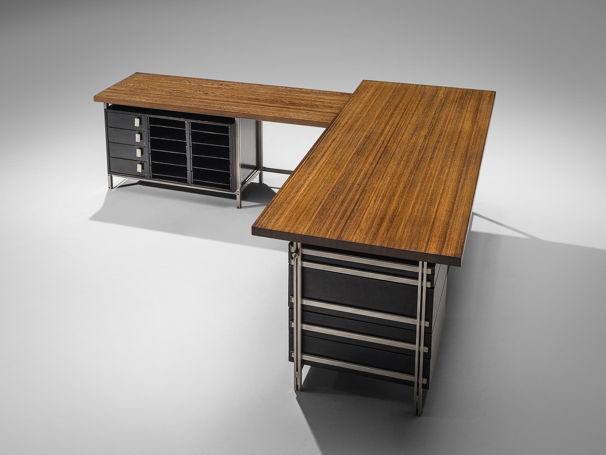 Jules Wabbes, writing desk with drawer pieces, wenge wood tabletop, chrome frame, black drawers, Belgium, 1960s.

This corner desk is designed by Jules Wabbes. The table is executed with a solid wenge wooden top, made out of tangentially-sawn wenge