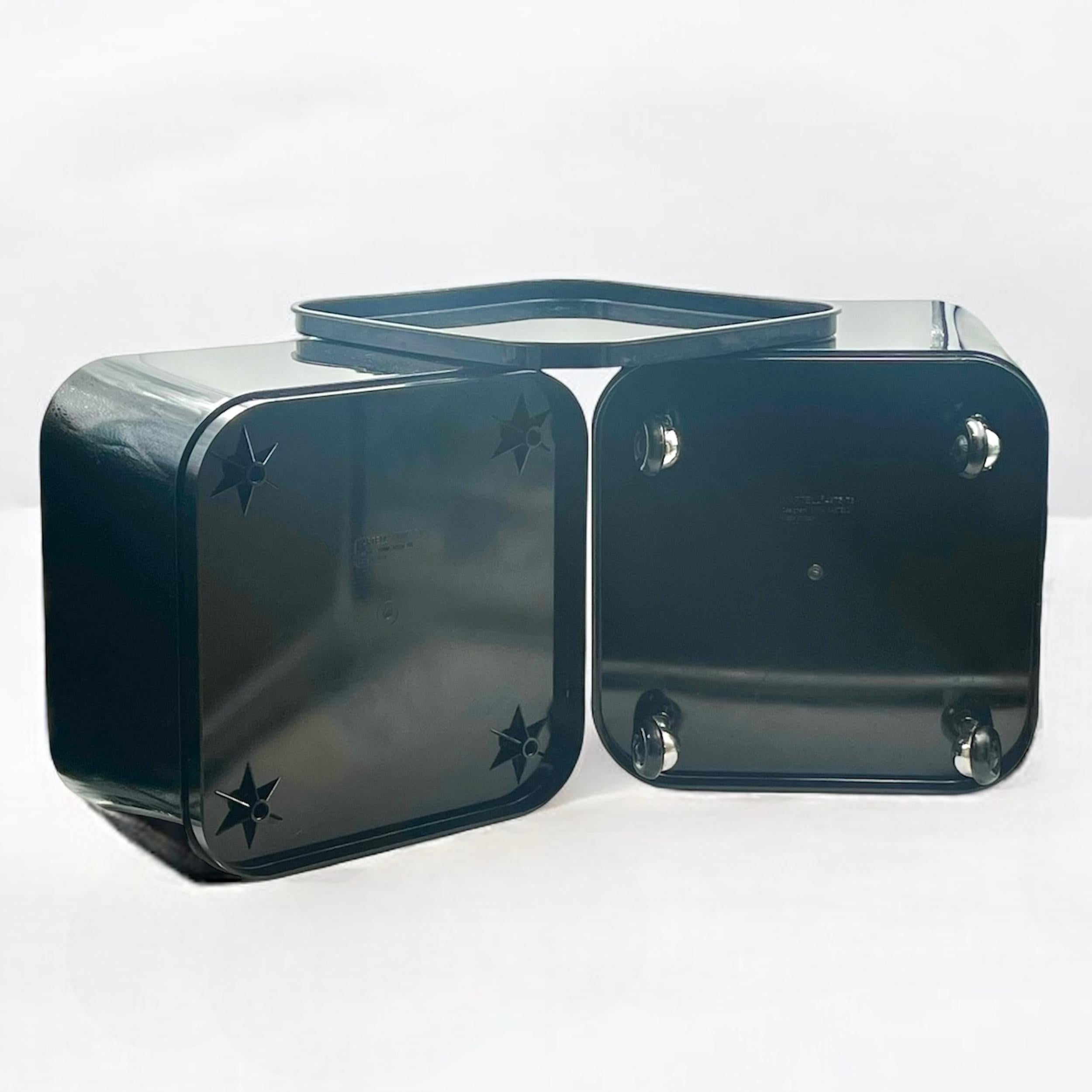 Exuding timeless elegance, the original Kartell Componibili storage unit from the 1960s stands as a beacon of refined Italian design. Crafted by the visionary Anna Castelli Ferrieri, this piece, composed of two sleek, glossy black modules (models