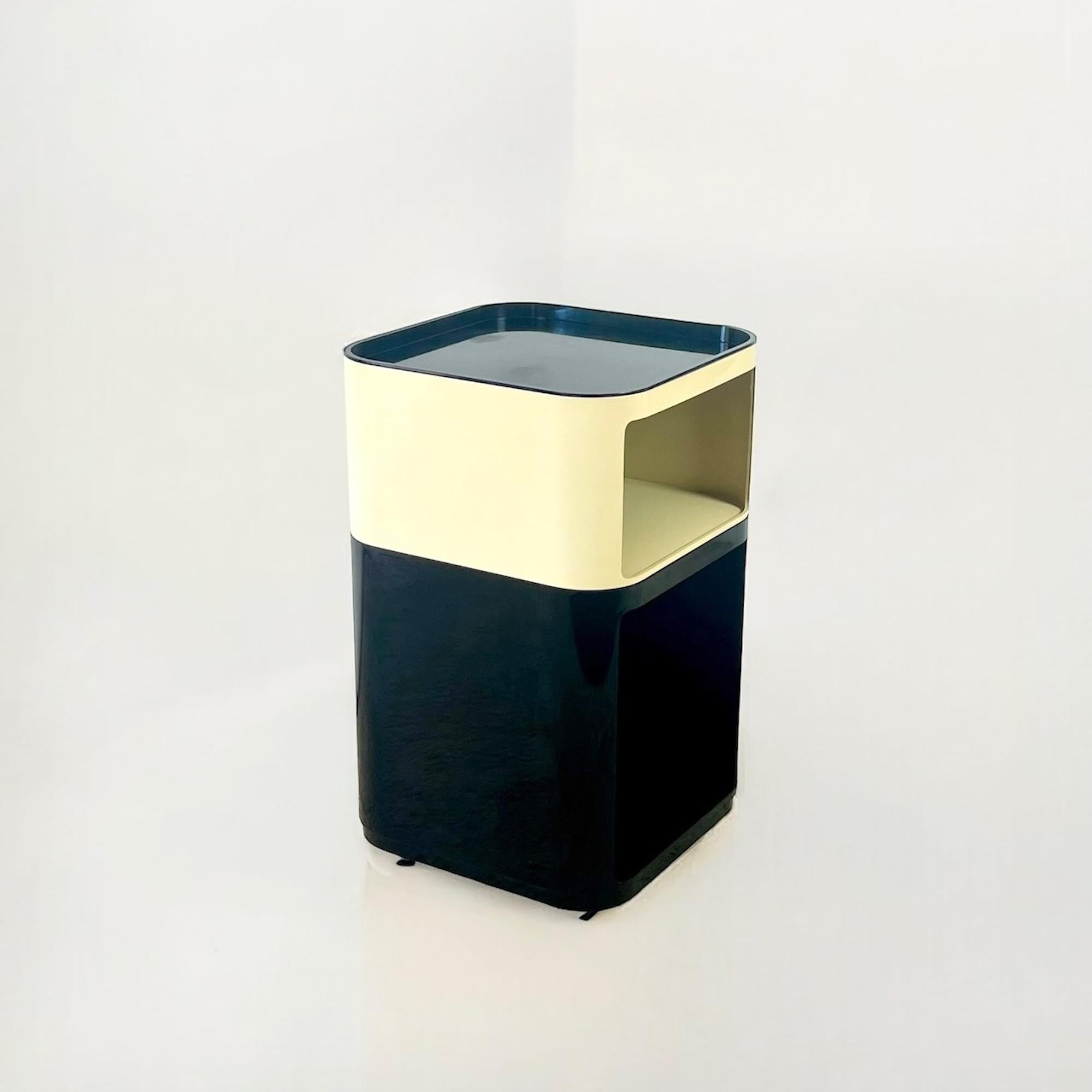 Discover a quintessential piece of Space Age furniture design with these rare Kartell Componibili units, designed by the legendary Anna Castelli Ferrieri in the 1960s. These particular models, the 4975/76 in sleek black and the 4970 in classic
