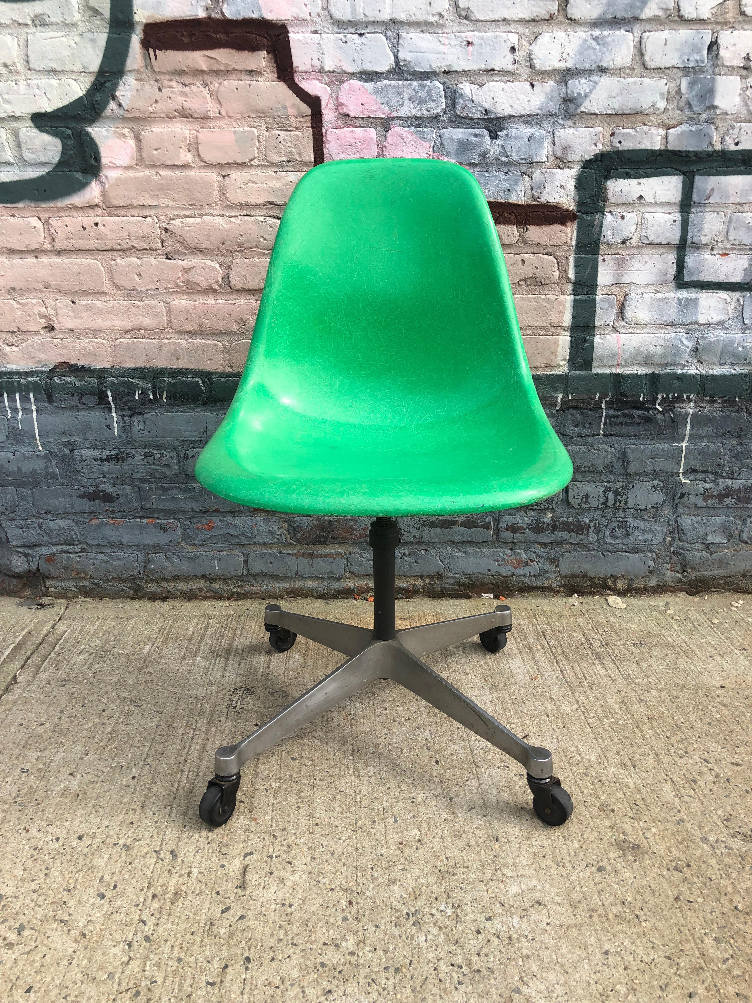 This is a very rare color green Eames desk chair. Features adjustable height swiveling base with wheels. Very comfortable to sit in for long periods. Signed with manufacturers stamp underneath.