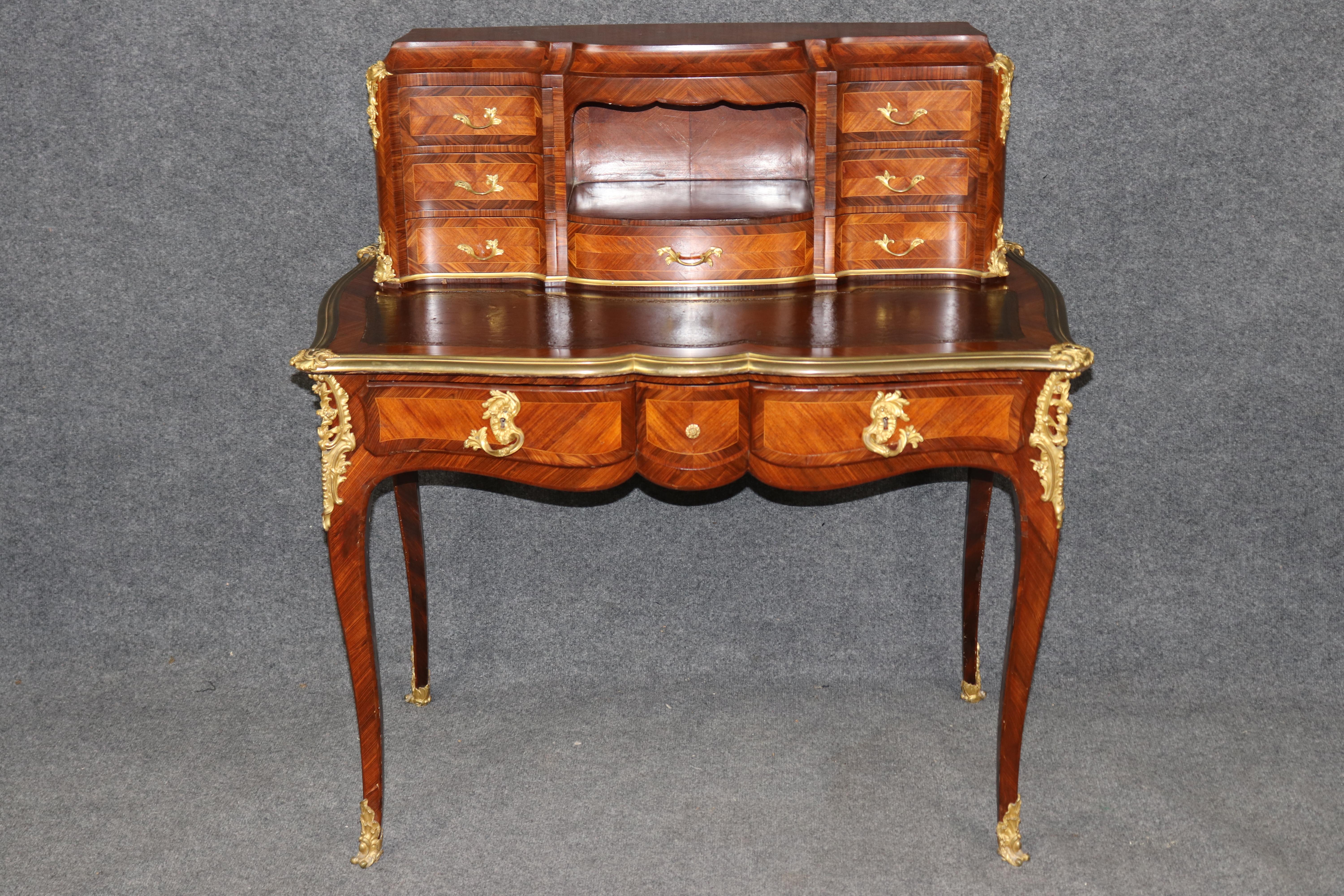 This stunning French Louis XV style ladies desk by renowned Parisian ébéniste Léon Dromard exemplifies the height of 19th-century French elegance and craftsmanship. Beautifully veneered in exotic kingwood and rosewood, the desk features elegant