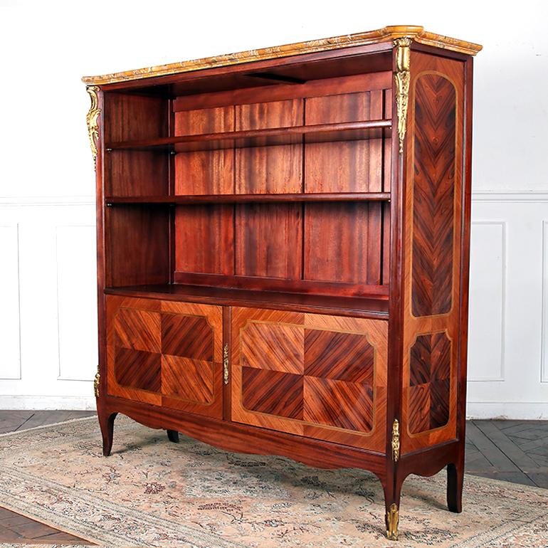 Exceptional Quality Louis XV Style Bookcase in Kingwood and Mahogany parquetry, with thick 1-3/4″ marble top. With original ormolu mounts and hardware, this is a truly fine and rare piece. 