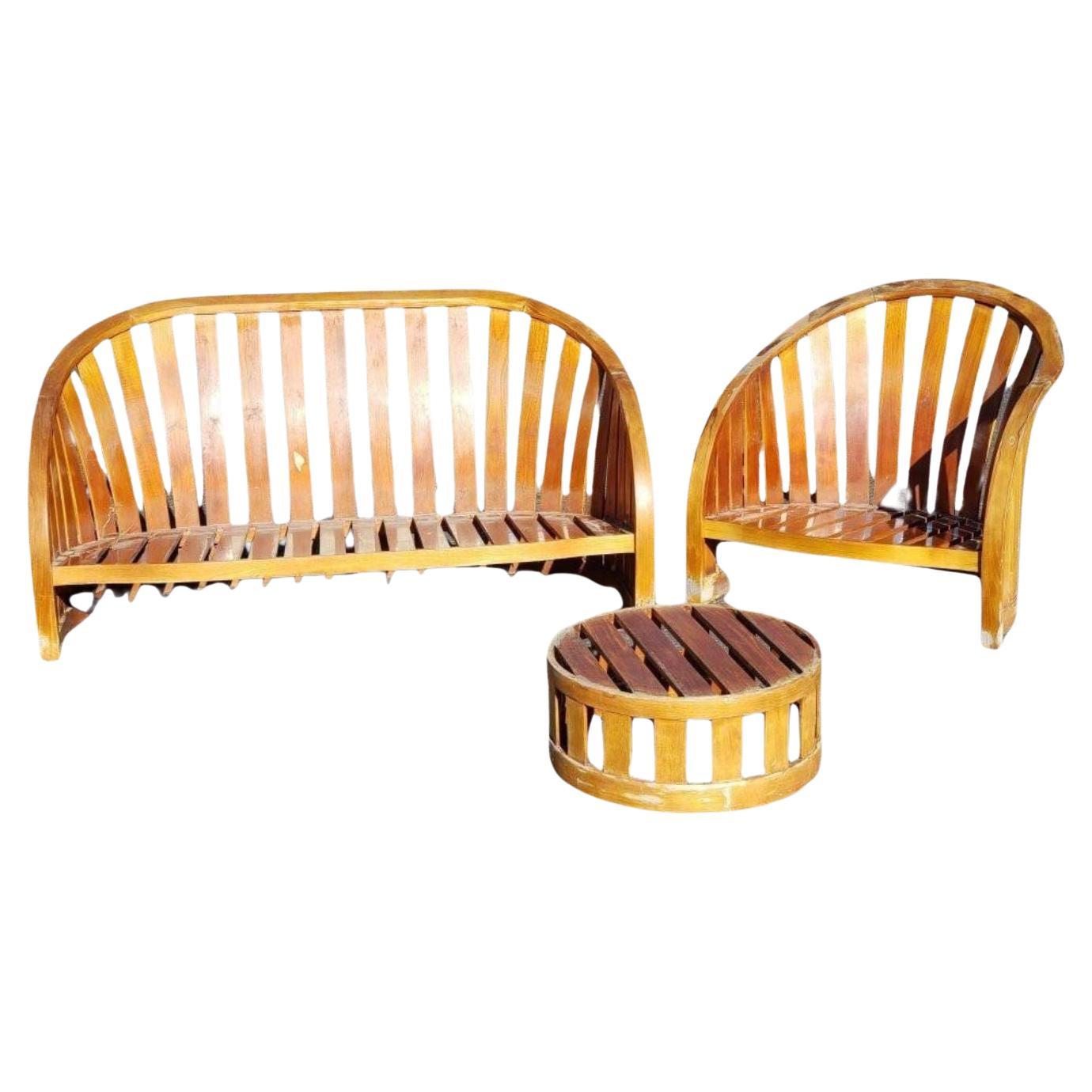A rare and highly collectible four-piece slatted lounge set designed by celebrated American designer Kipp Stewart for Summit Furniture, Carmel, California, circa 1980s. This sculptural ensemble showcases Stewart’s signature approach to clean lines,