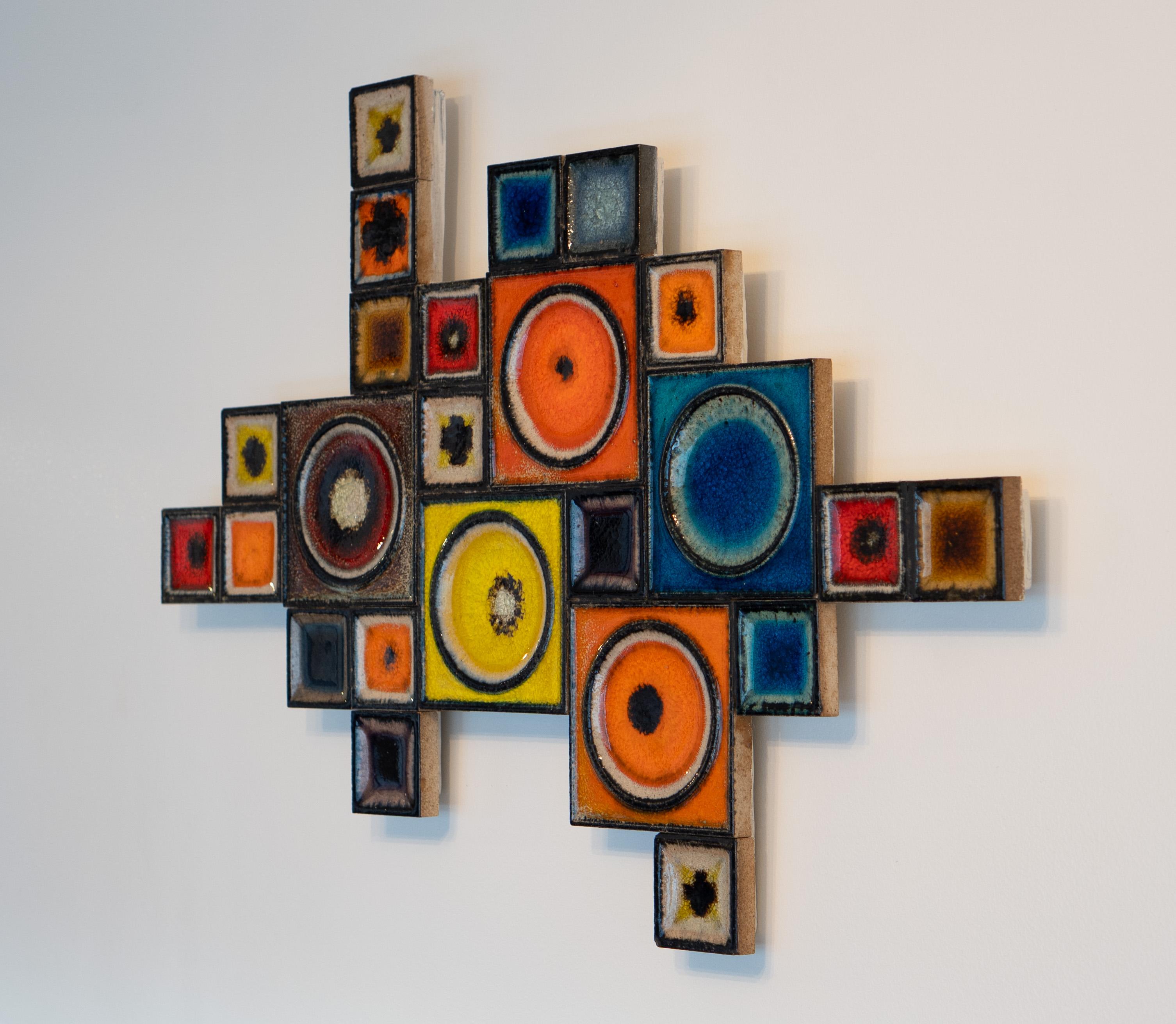 Designed and made by Konrad Galaaen, this series of sculptures was made in Norway. Made of many squares of varying sizes, they form an abstract shape with no definable pattern. Like the other known examples, this one features awesome colors. After
